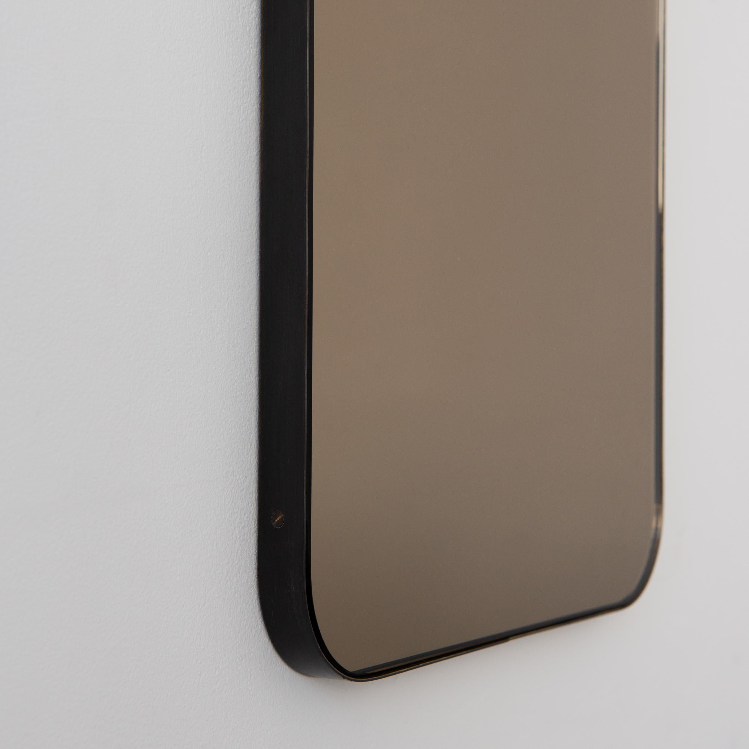 Modern rectangular mirror with an elegant solid bronze patina brass frame. Part of the charming Quadris™ collection, designed and made in London, UK. 

Our mirrors are designed with an integrated French cleat (split batten) system that ensures the
