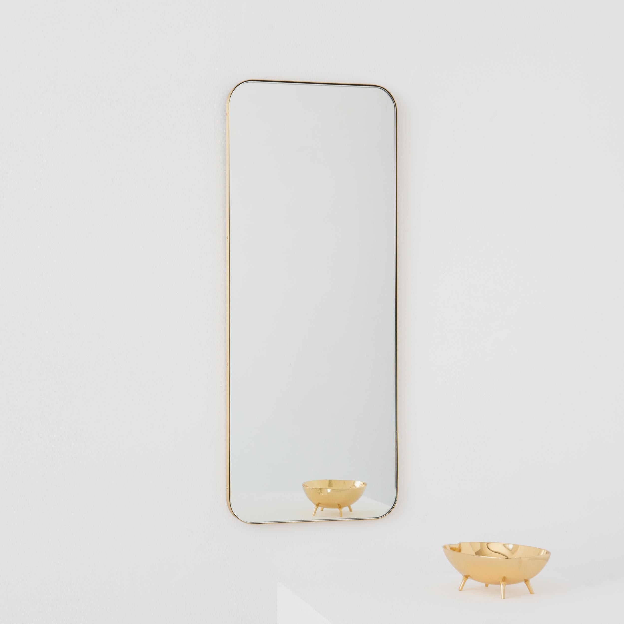 Modern Quadris™ rectangular mirror with an elegant solid brushed brass frame. Designed and handcrafted in London, UK. 

Our mirrors are designed with an integrated French cleat (split batten) system that ensures the mirror is securely mounted flush