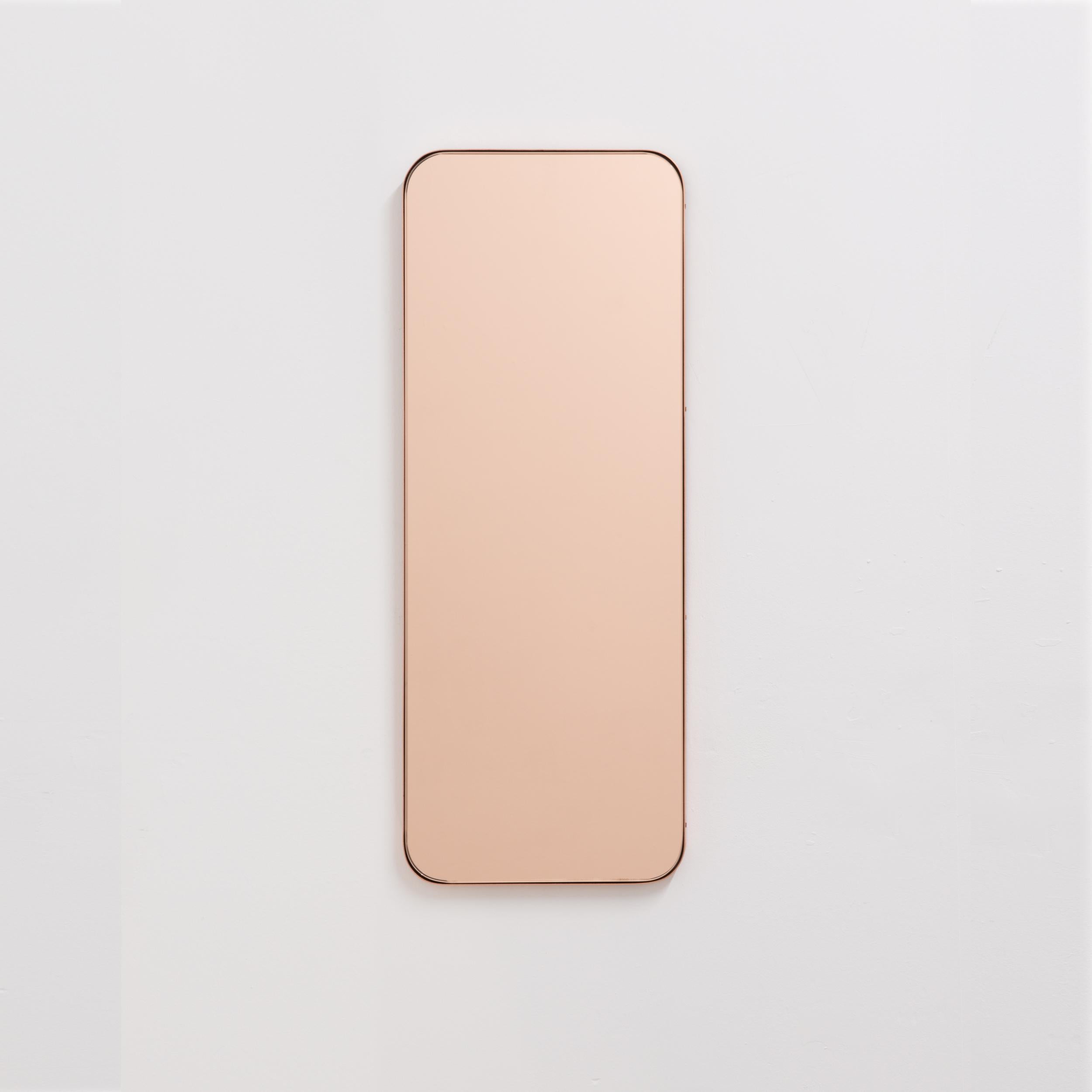 Minimalist rectangular mirror with an elegant slim brushed copper frame. The detailing and finish, including visible copper plated screws, emphasise the crafty and quality feel of the mirror, a true signature of our brand. Designed and handcrafted