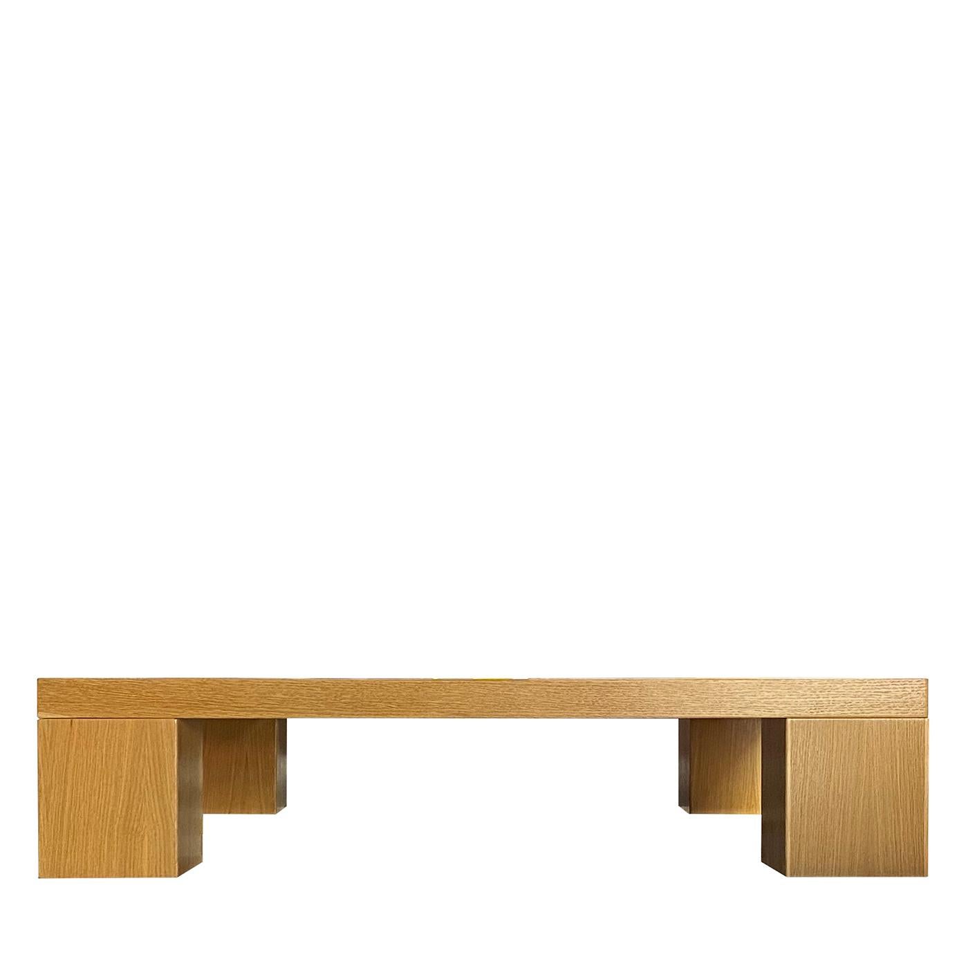 Part of a limited series of only 10 numbered pieces, this square coffee table is a showcase of geometric refinement and unpredictable natural allure. The grain offered by the minimalist durmast structure sharply conflicts with the luminous inlay in