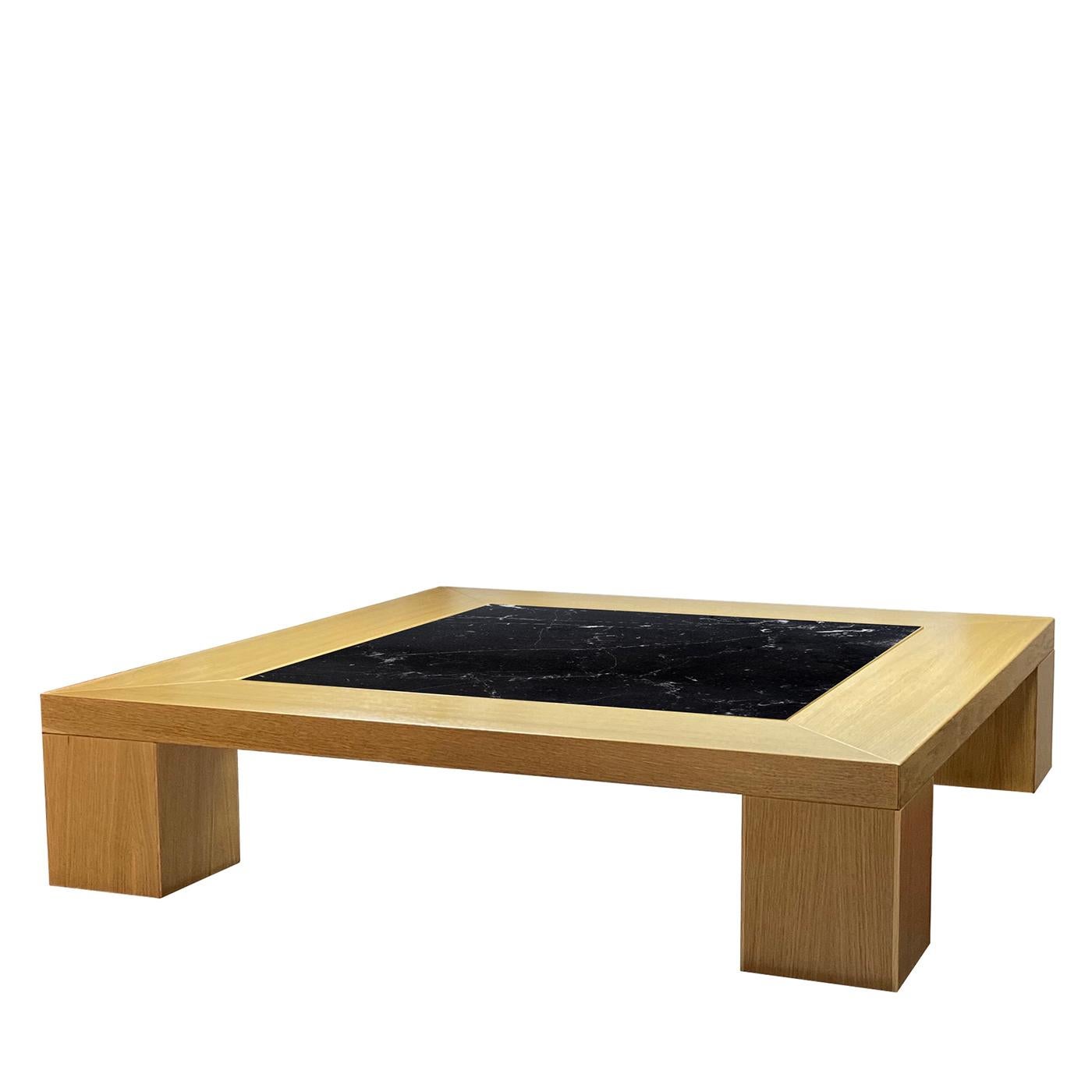 A bold accent piece adding character and functionality to a luxe modern space, this square coffee table is an exercise in geometric rigor and unique traceries drawn by nature. Set in a sturdy durmast frame showcasing singular grain, the black