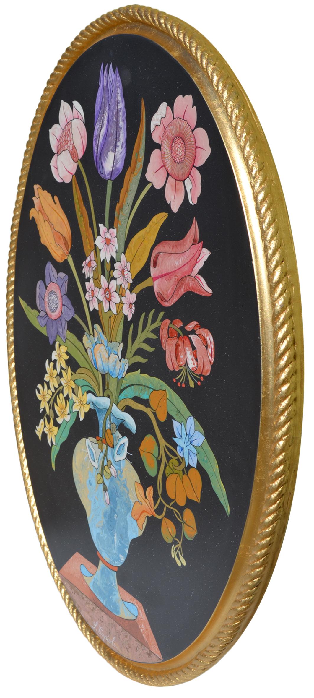 Fleurs ovales noires incrustées et cadre doré Fait à la main par Cupioli Italia.
Tableau mural ovale, réalisé à la main par nos artisans selon l'ancienne technique italienne de l'incrustation scagliola. L'œuvre représente un vase raffiné de fleurs