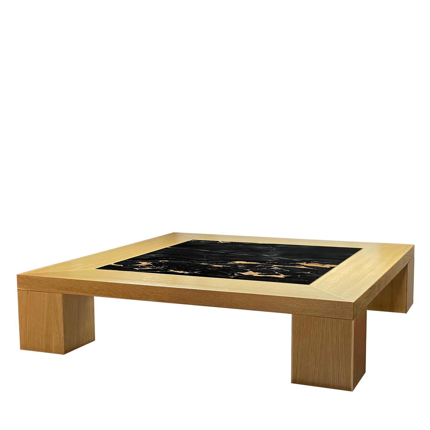 This exquisite coffee table was designed by Ferdinando Meccani having opulence and minimalism in mind. Part of a numbered series counting 10 pieces, it sports an essential yet bold durmast silhouette enriched at the top by a breathtaking inlay in