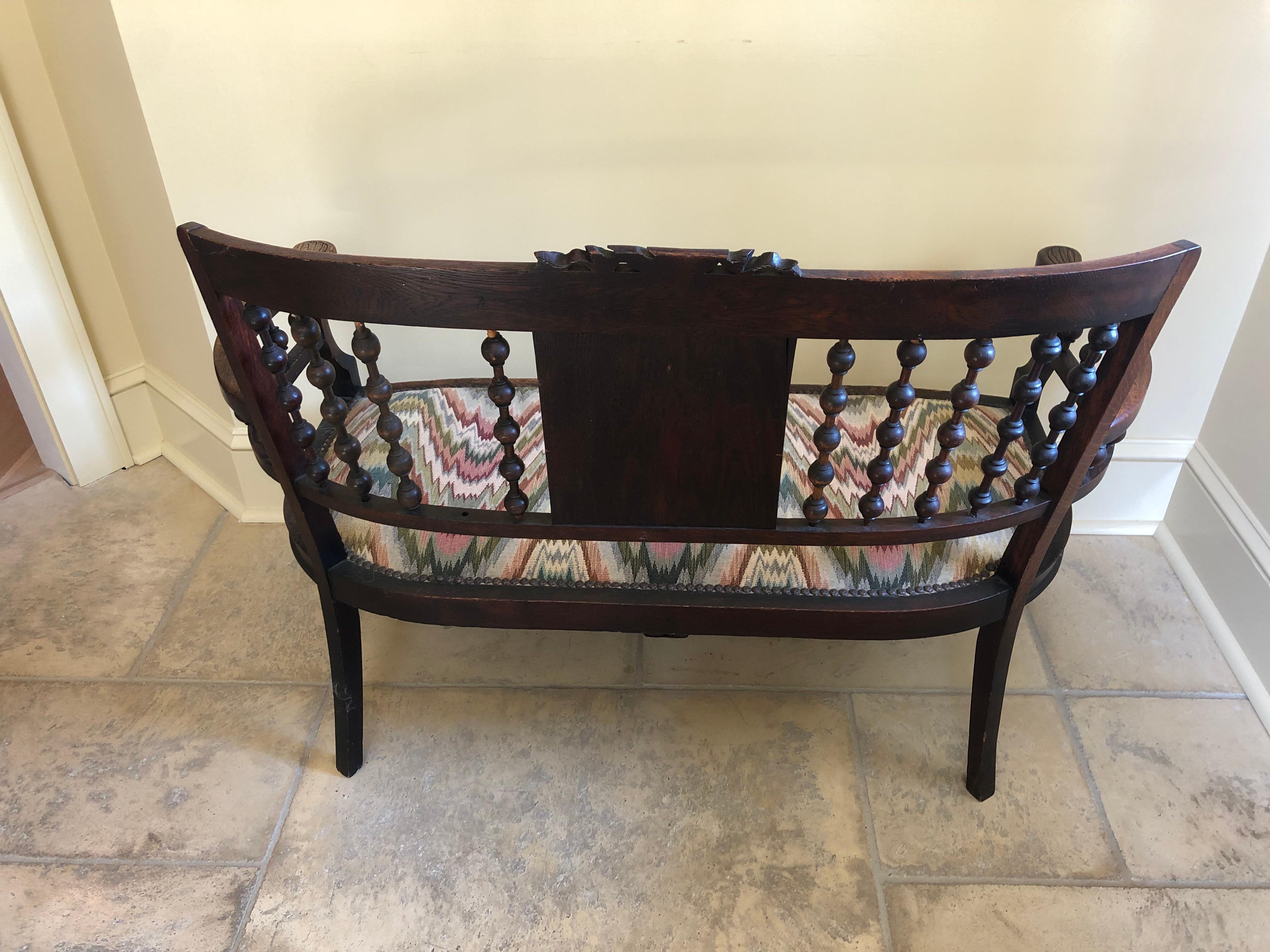 North American Quaint Small Victorian Carved Walnut Loveseat Settee with Flame Stitch Seat For Sale