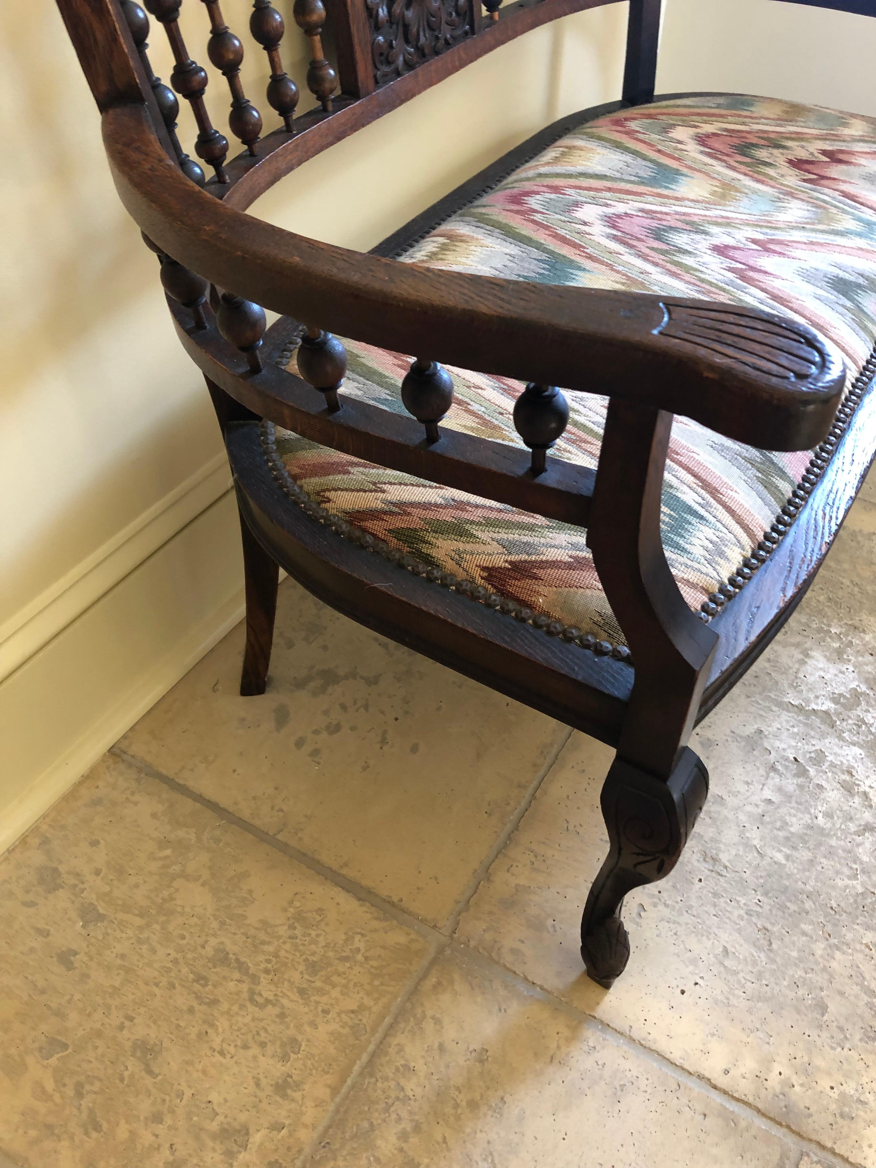 Quaint Small Victorian Carved Walnut Loveseat Settee with Flame Stitch Seat In Good Condition For Sale In Hopewell, NJ