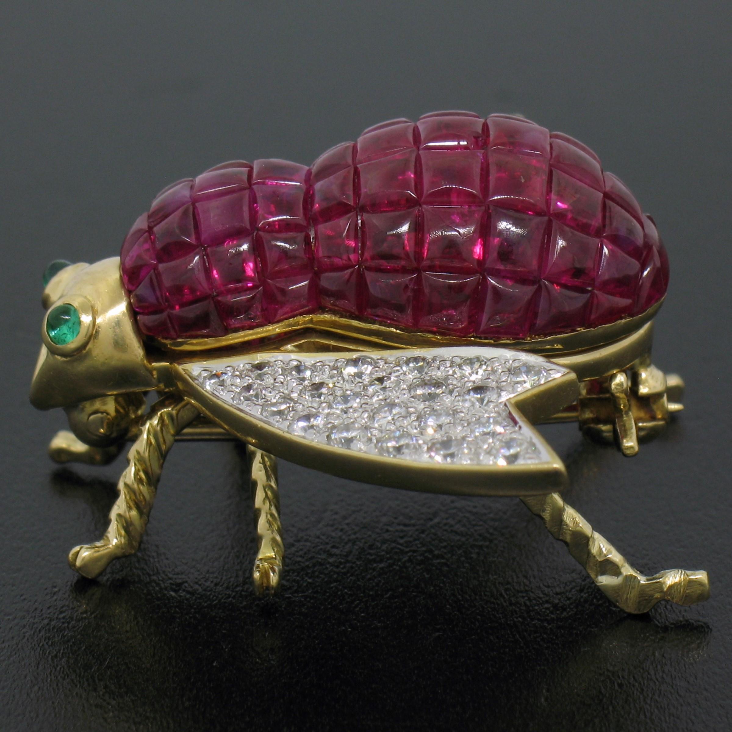 You are looking at a breathtakingly designed and very well-made brooch crafted in solid 18k yellow gold. The design features a large and lovely bee/fly covered with custom cut rubies throughout its body along with very fine quality round brilliant