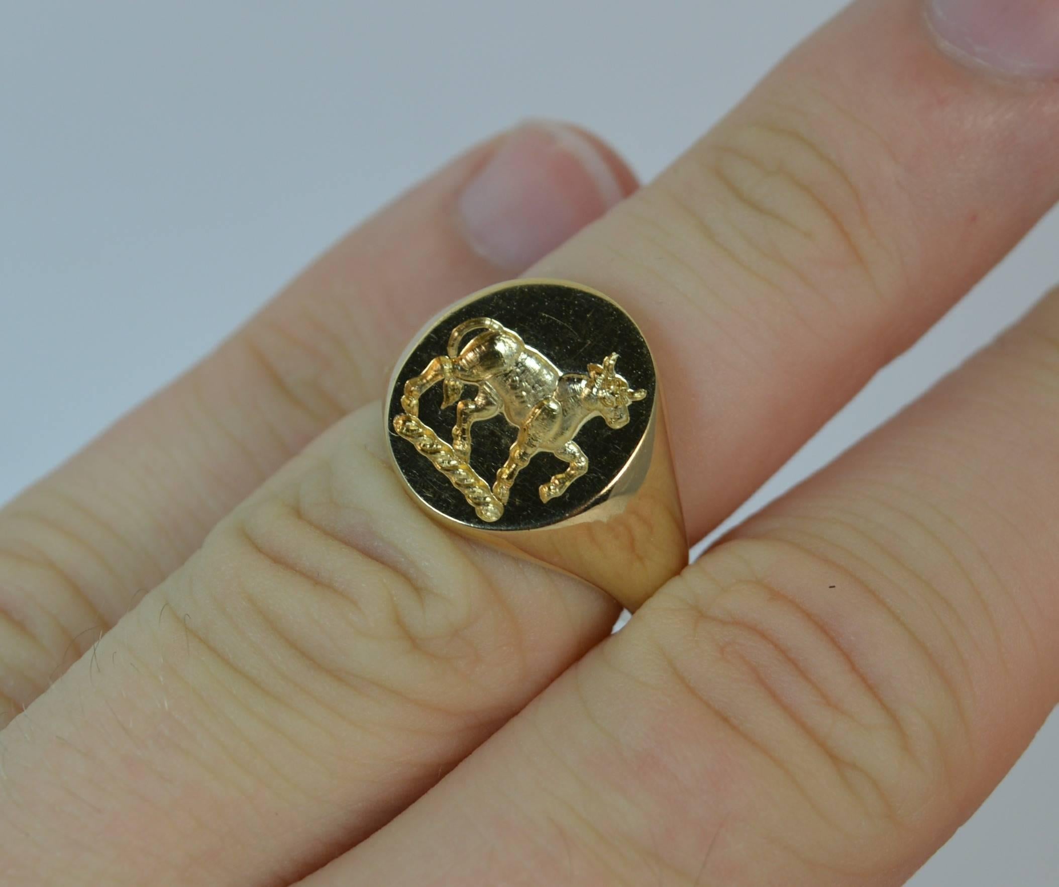 
A stunning contemporary 9ct gold signet ring.

​The 12mm x 14mm oval head is expertly engraved with an intaglio of a prancing bull.

A solid and heavy 9 carat yellow gold example.


CONDITION ; Very good. Very crisp intaglio. Solid and chunky