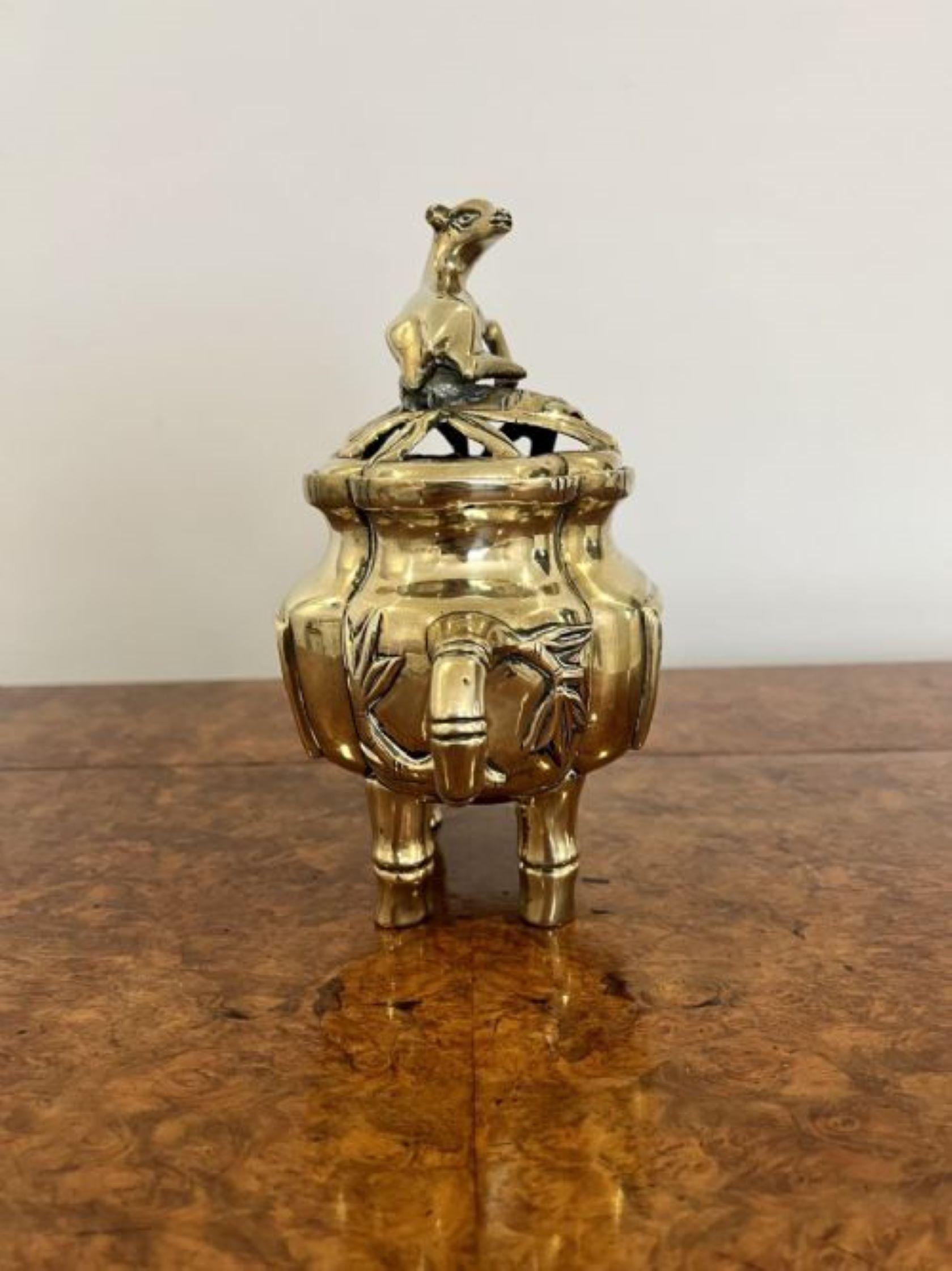 Quality antique brass Chinese lidded incense burner having a quality brass incense burner with a pierced removable lid decorated with a deer, going down the body to two panels having scenes of birds and deers raised on bamboo style feet with two
