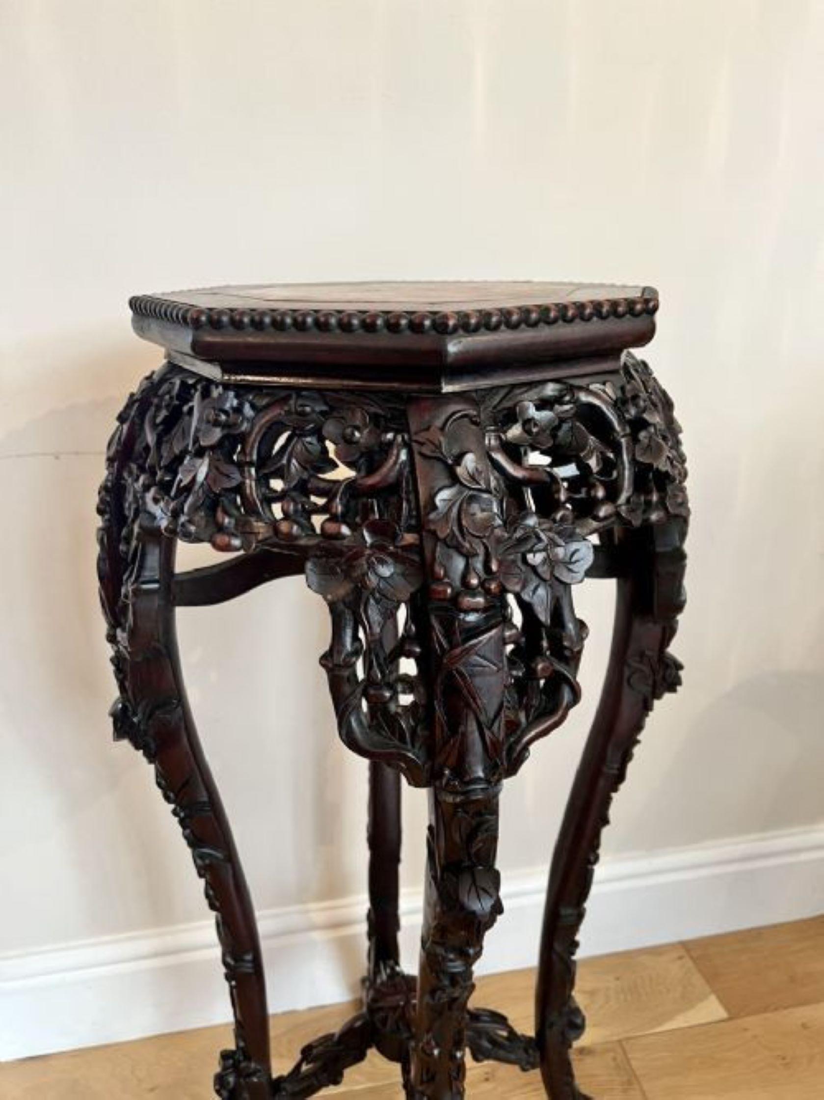 Quality antique carved hardwood Chinese stand having a marble top with a hardwood carved edge, outstanding quality carved frieze standing on shaped carved cabriole legs with scroll feet united by a carved stretcher 