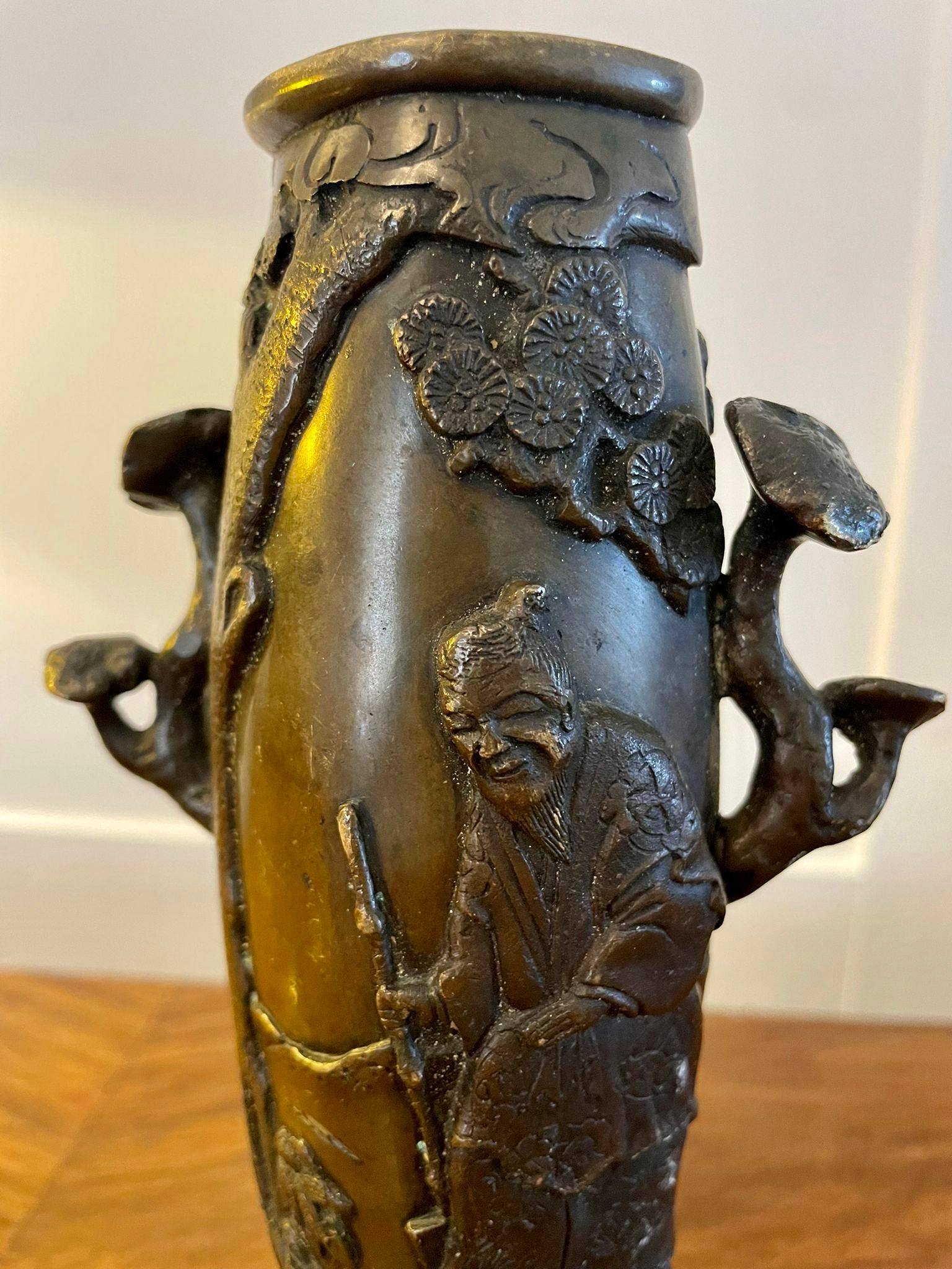 Quality antique Chinese bronze vase having a quality ornate Chinese decorated bronze vase featuring a blossom tree, oriental male figure and an oriental female stood with crane

Measures: H 18 x W 10 x D 6cm
Date 1880.
  
