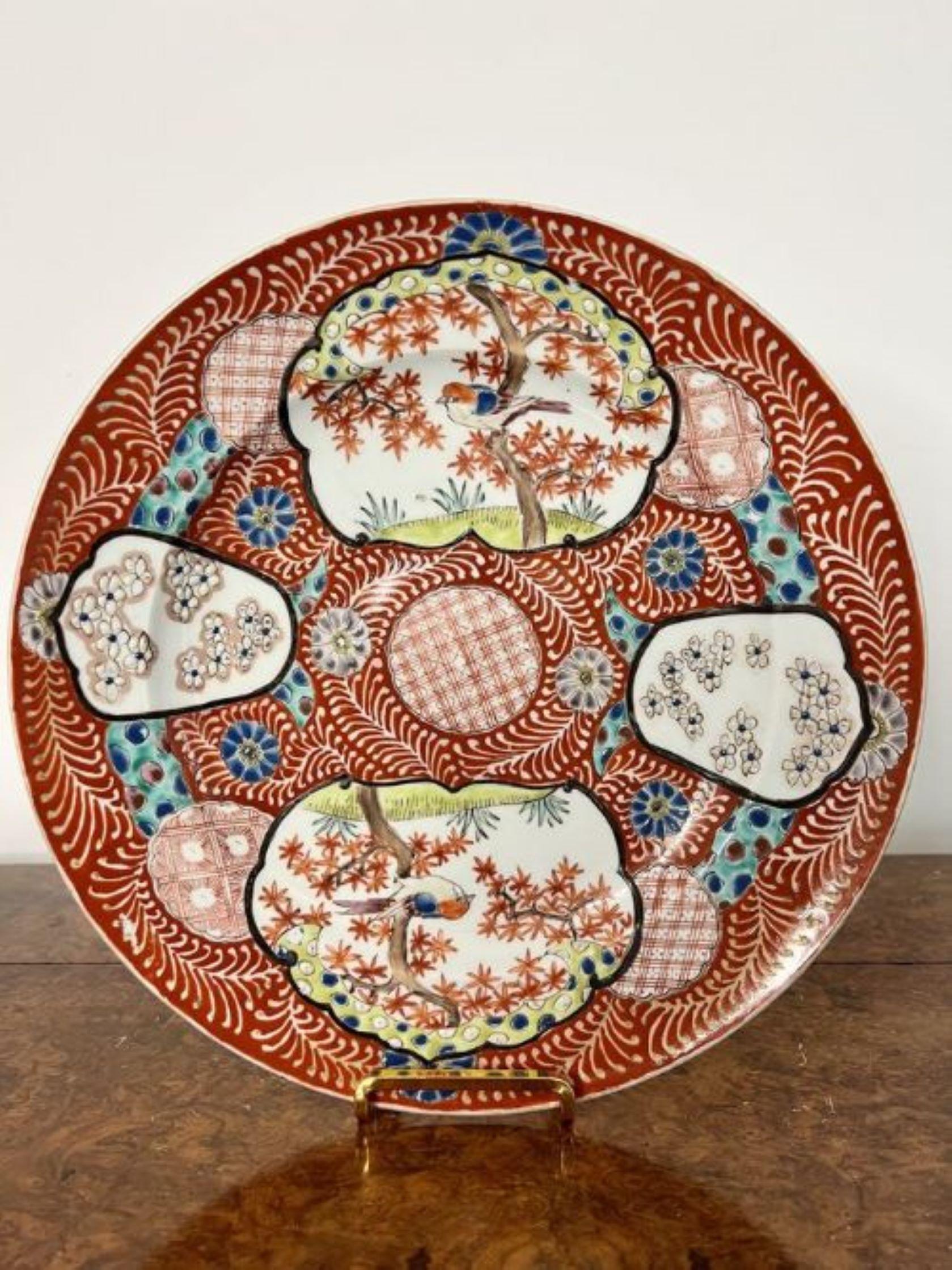 Quality antique Chinese porcelain plate having a quality antique Chinese plate decorated with birds, trees and flowers in fantastic red, blue, green and white colours.