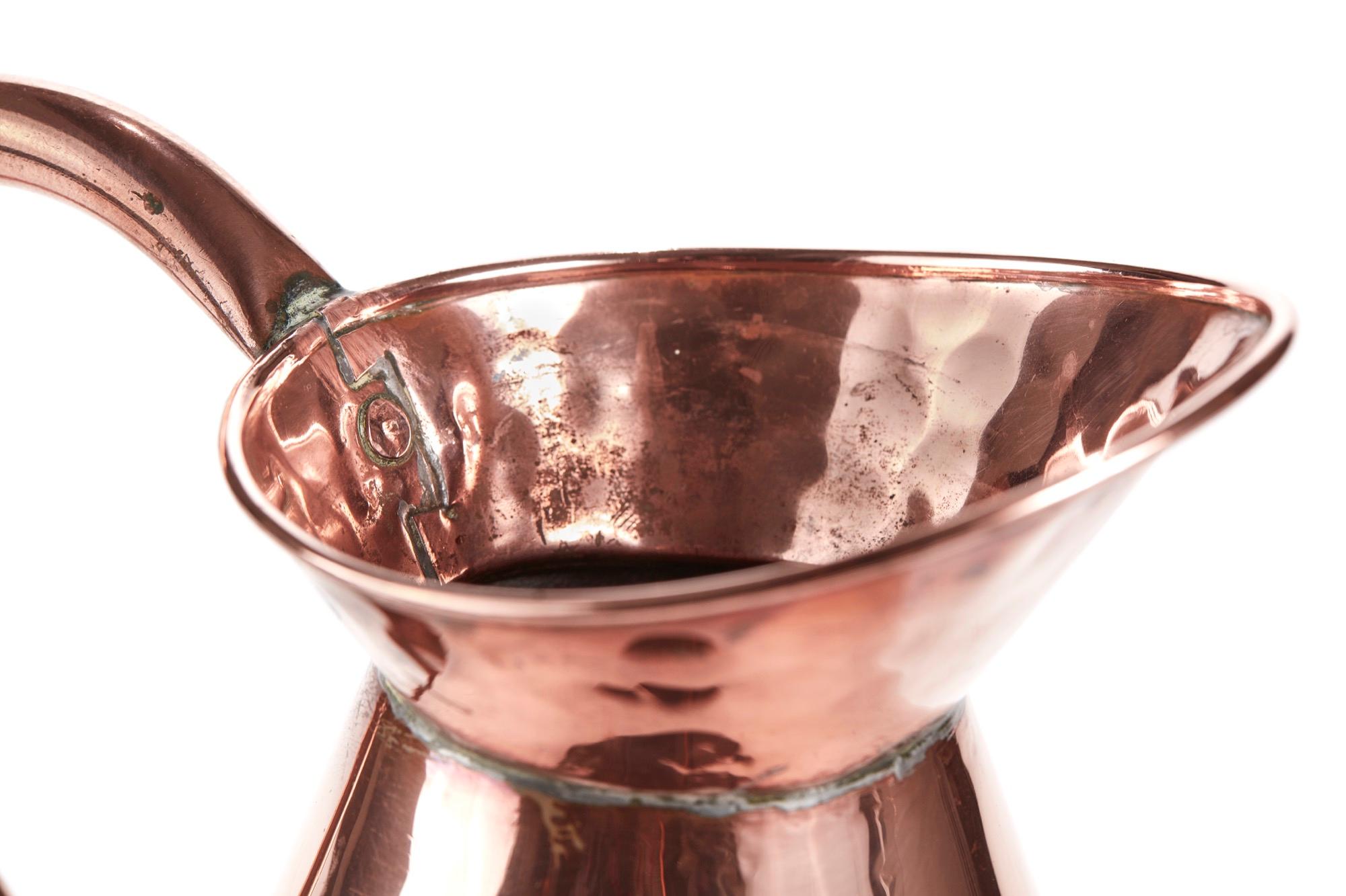 Quality antique copper jug. Lovely shaped handle, shaped body on a round base. Lovely antique condition.