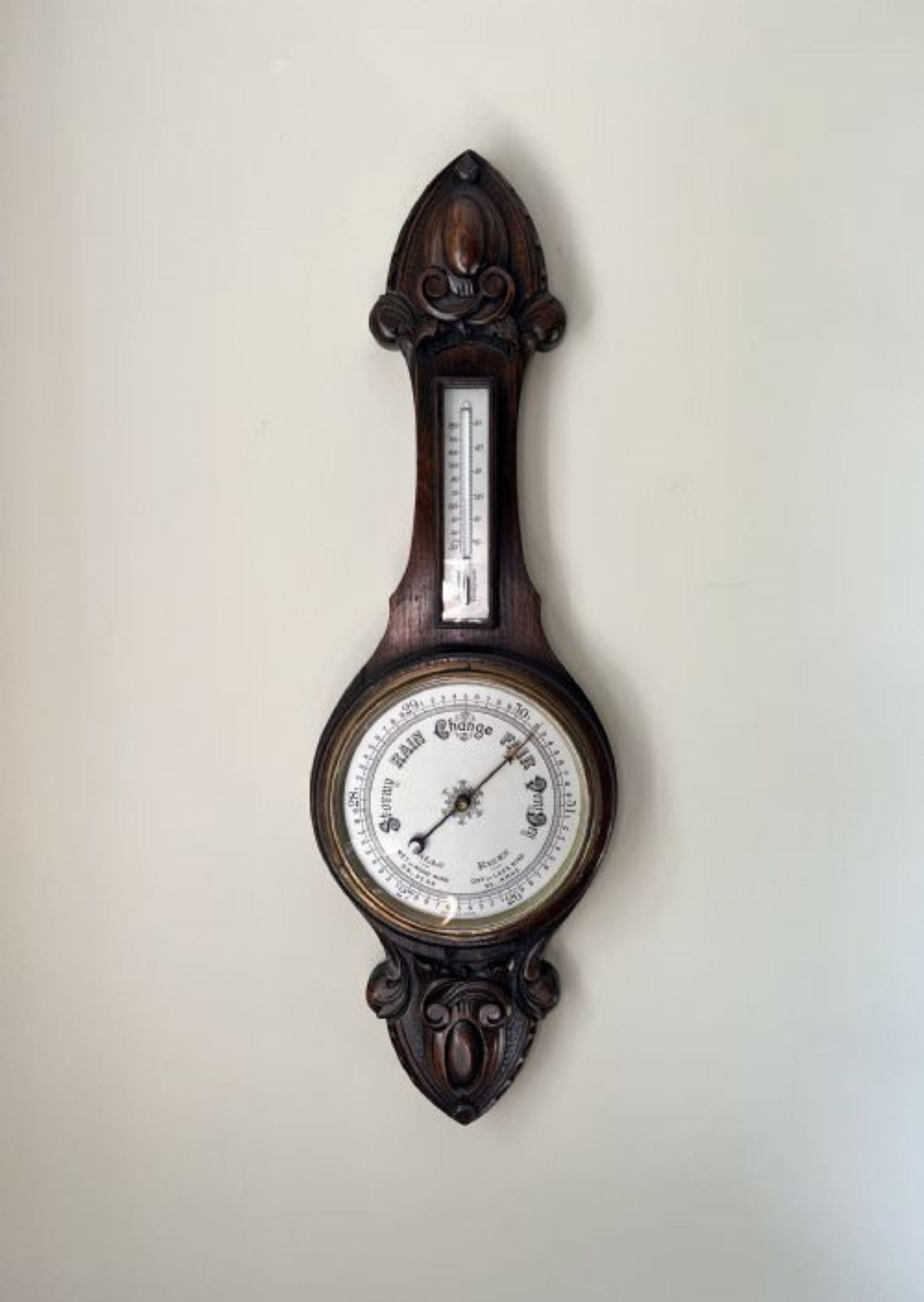 Quality antique Edwardian carved oak aneroid barometer having a quality antique Edwardian carved oak barometer with a quality carved oak case, the original brass bezel, porcelain dial and thermometer. 