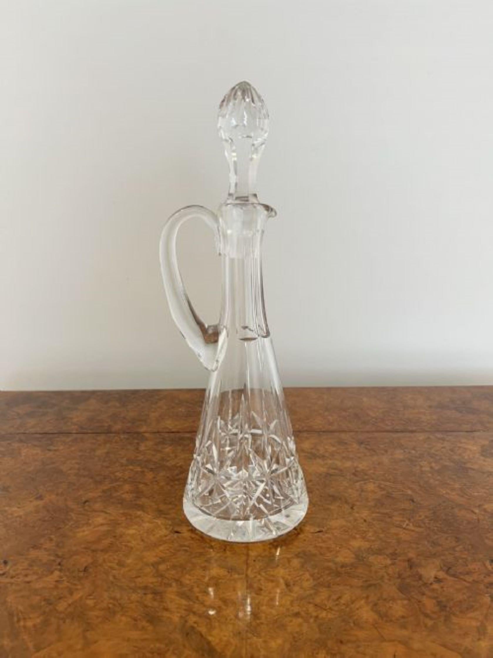 Quality antique Edwardian cut glass ewer having a quality antique Edwardian cut glass ewer with a shaped handle and a cut glass stopper Quality antique Edwardian cut glass ewer having a quality antique Edwardian cut glass ewer with a shaped handle