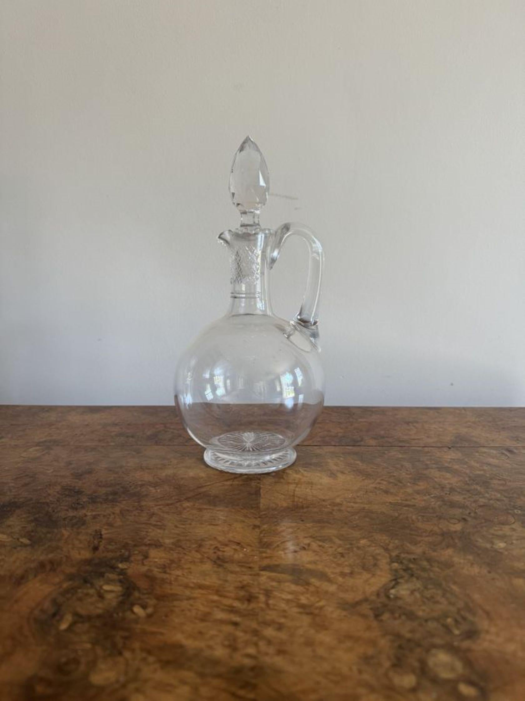 Quality antique Edwardian glass ewer, having a quality glass were with cut glass detail and the original cut glass stopper.

D. 1900