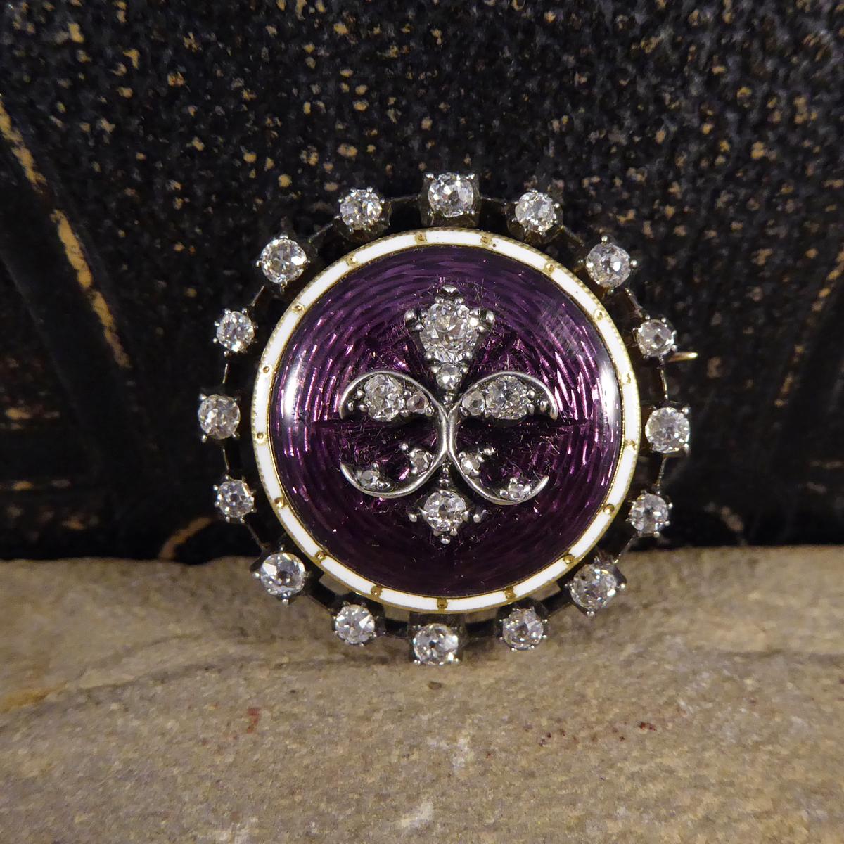 Showing that quality jewellery really does stand the test of time, this gorgeous pristine purple Enamel antique mourning brooch was hand crafted in the Victorian era. This antique brooch is gold backed and silver fronted and has Diamonds adorning as