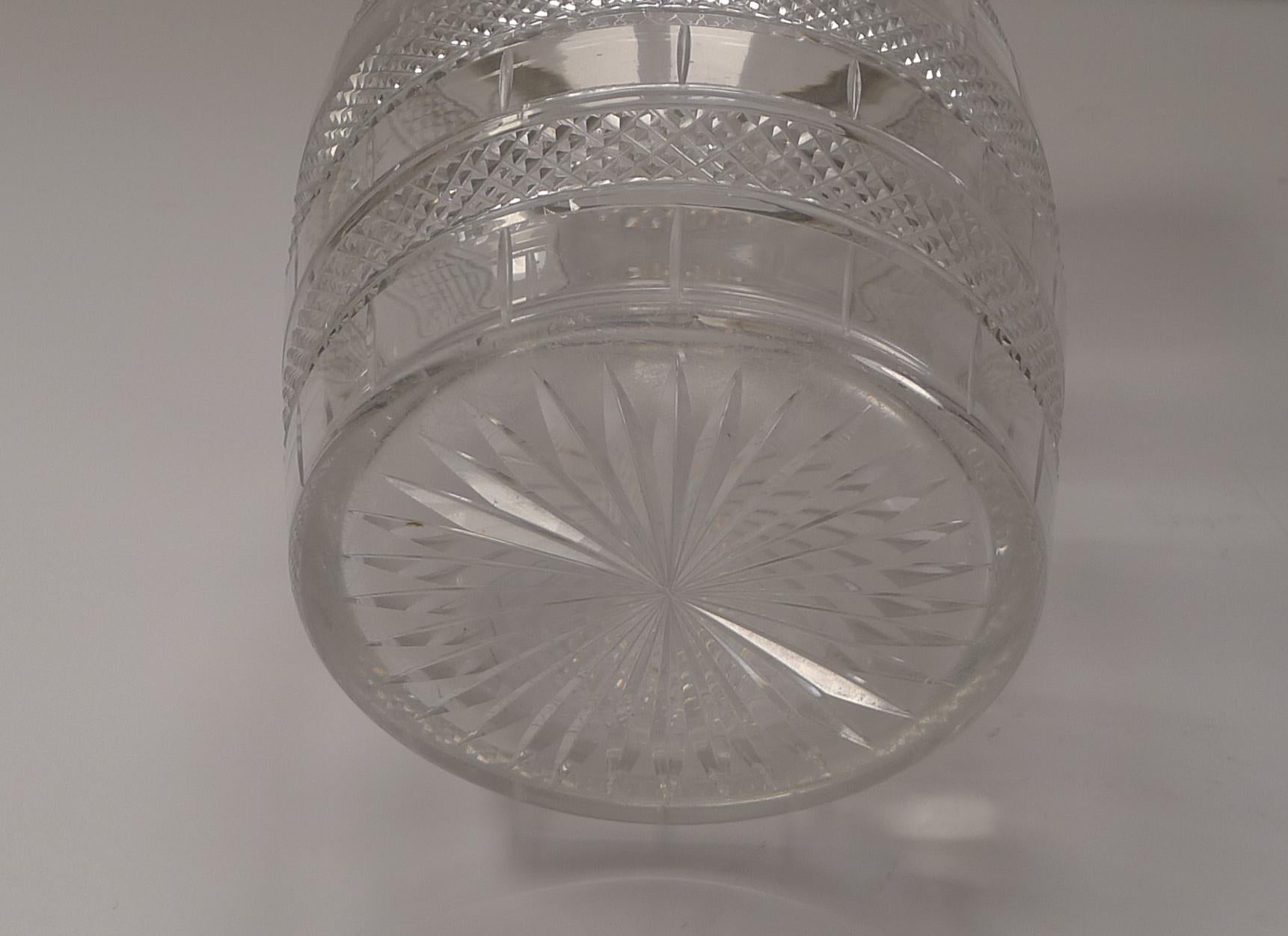 A particularly good and unusual cut glass biscuit box which would equally make a wonderful ice bucket or pail.

Earlier than most of this type, it dates to around 1860, mid-Victorian in era. The glass is beautifully hand-cut to emulate a coopered