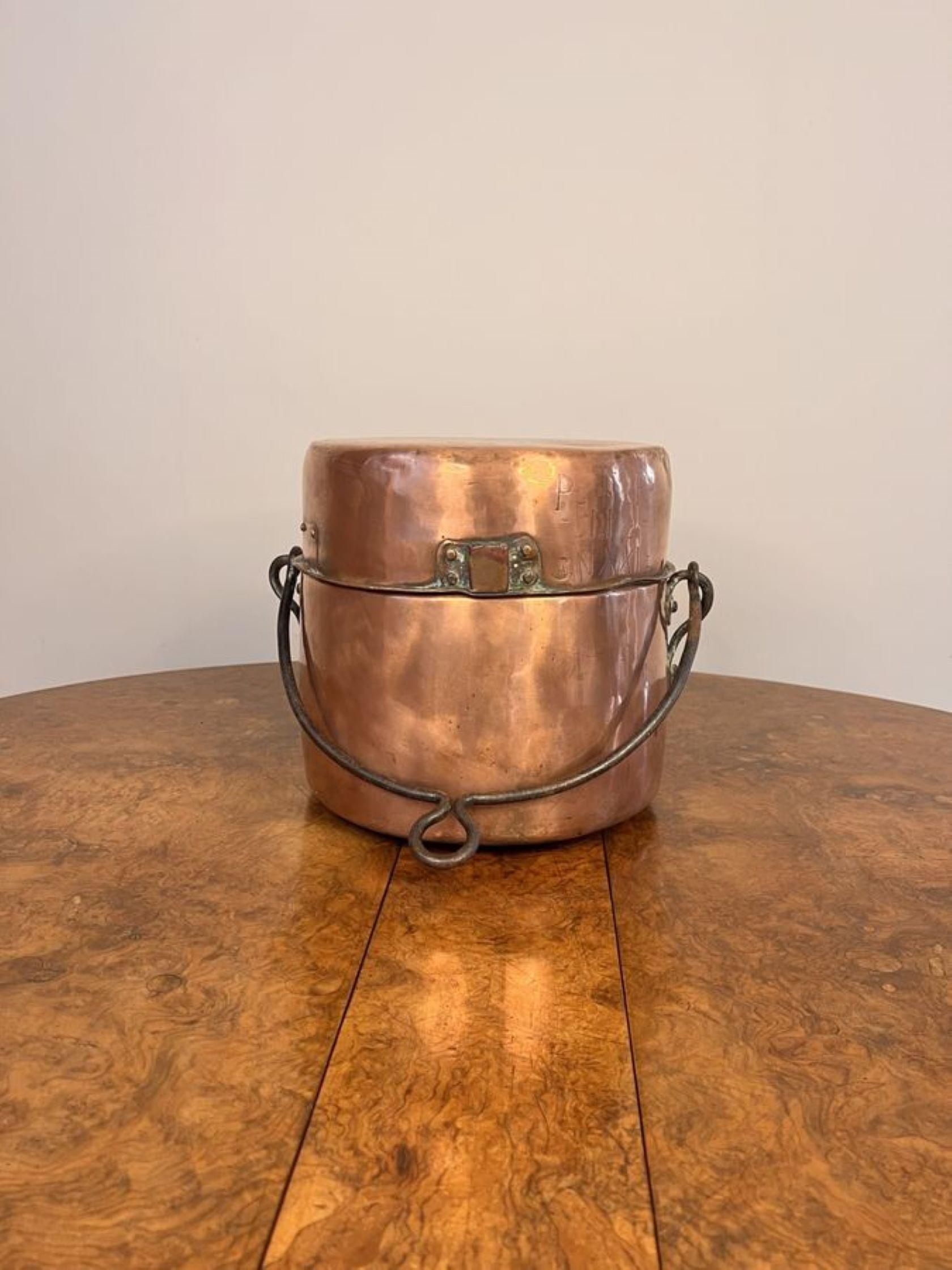Quality antique George III copper cooking pot, having a iron swing handle and a removable copper lid, to the front PCN stamped 1770.

D. 1770