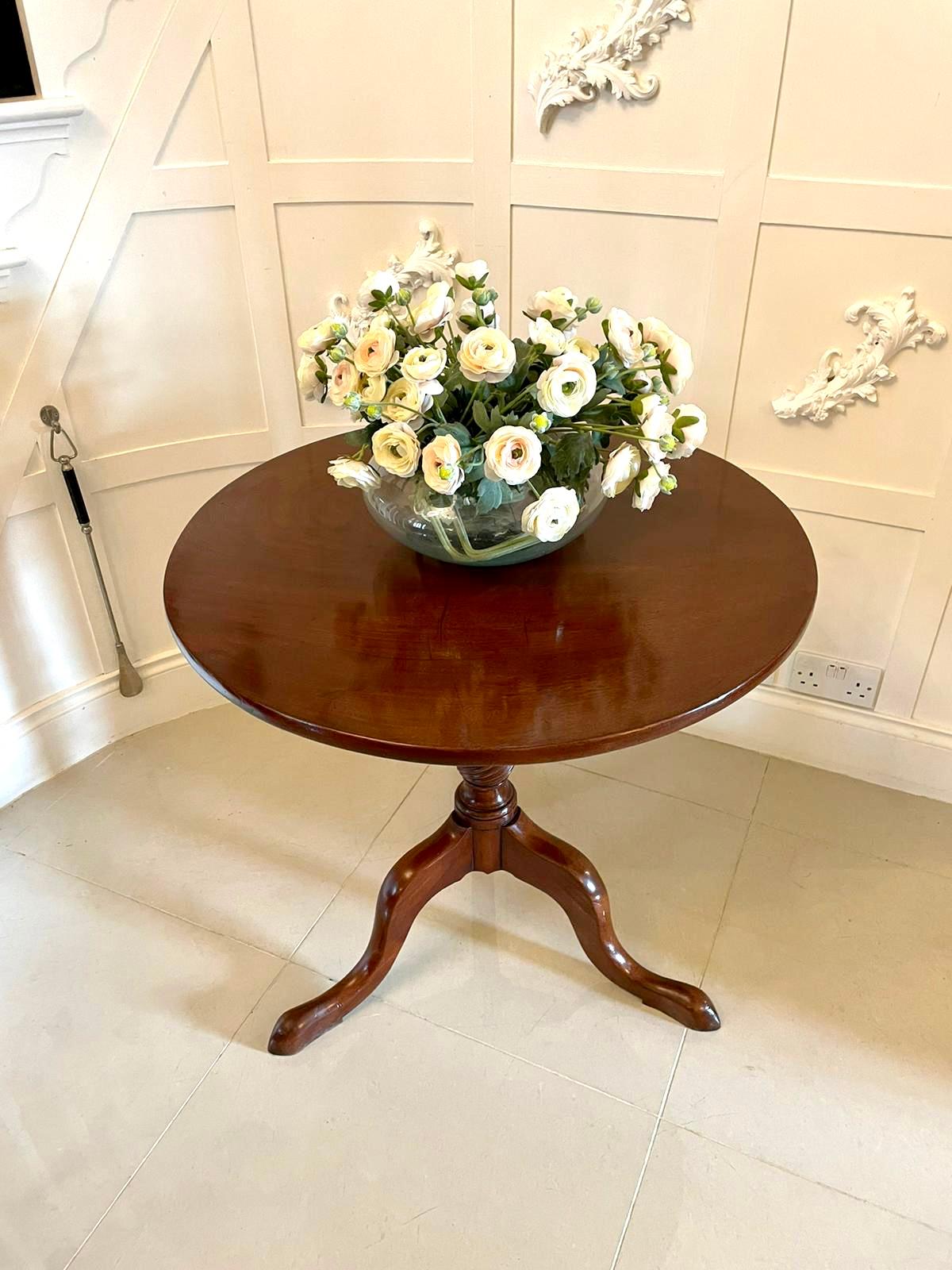 Quality antique 18th century George III mahogany circular tilt top centre table having a quality circular mahogany tilt top supported by a bird case with turned columns. It is raised on a turned and twist carved pedestal column and standing on three