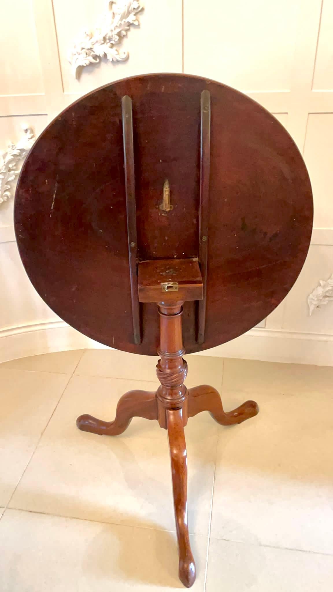 Quality antique George III mahogany circular tilt top centre table having a quality circular mahogany tilt top standing on a pedestal column with turned and twist carving raised on three shaped cabriole legs with pad feet.
 

Measures: H 73.5cm