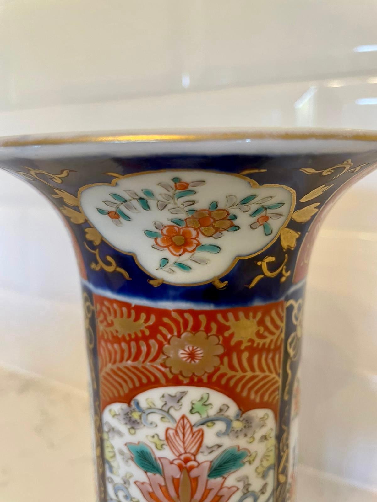 Quality antique Imari vase having quality hand painted panels with flowers, leaves and dogs and hand painted in fantastic red, blue, green, yellow and gold colours.

In lovely original condition.

Measures: H 26cm
W 12.5cm 
D 12.5cm 
Date