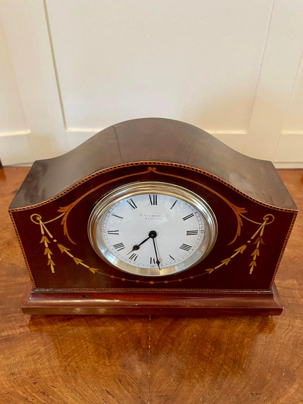 Quality antique inlaid mahogany eight day desktop clock by R Stewart of Glasgow having a quality mahogany case with a shaped top beautifully inlaid with harebells and swags to the front, enamelled dial with original hands and brass bezel, eight day