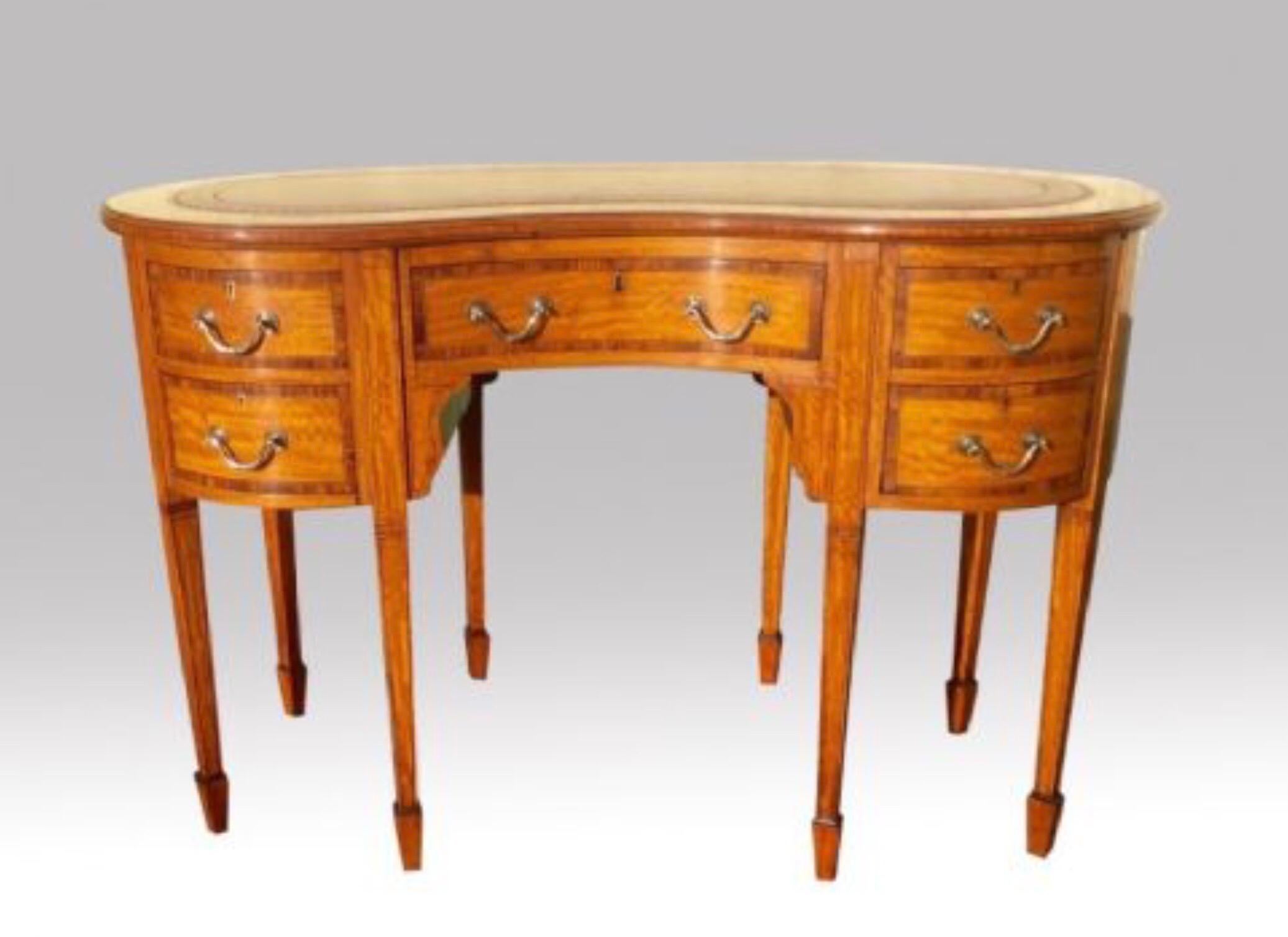 A stunning Quality antique Inlaid Satinwood and Kingwood banded kidney shape desk of Petite Proportions with Burgandy leather tooled hide.
Mahogany lined drawers.
(This antique desk is in fabulous condition)
Circa 1890
Measures: 47.5 ins x