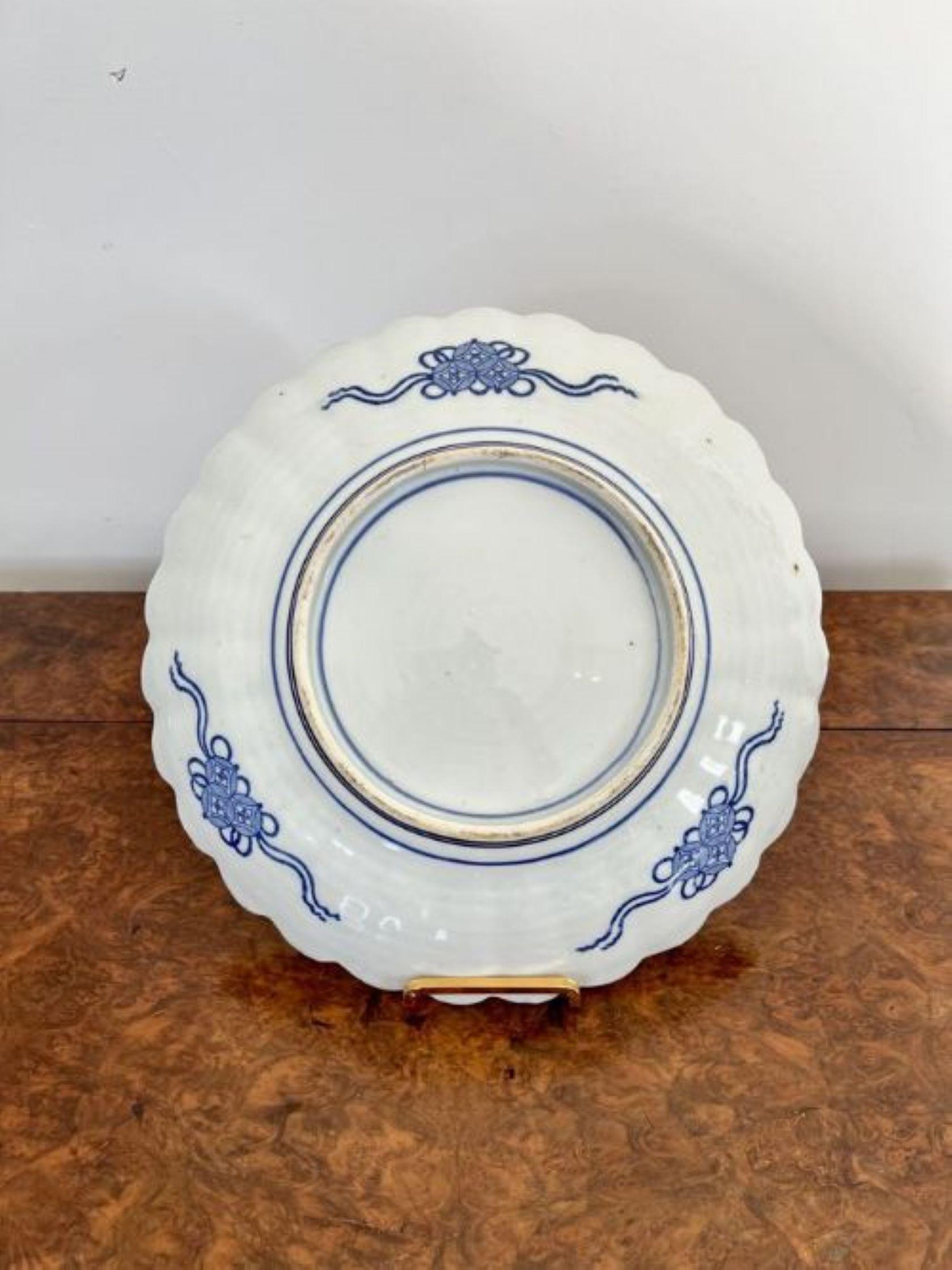 Quality antique Japanese blue and white imari scalloped edge plate having a quality antique Japanese imari blue and white plate, hand painted in wonderful blue and white colours decorated with a bird, flowers and a trees. 