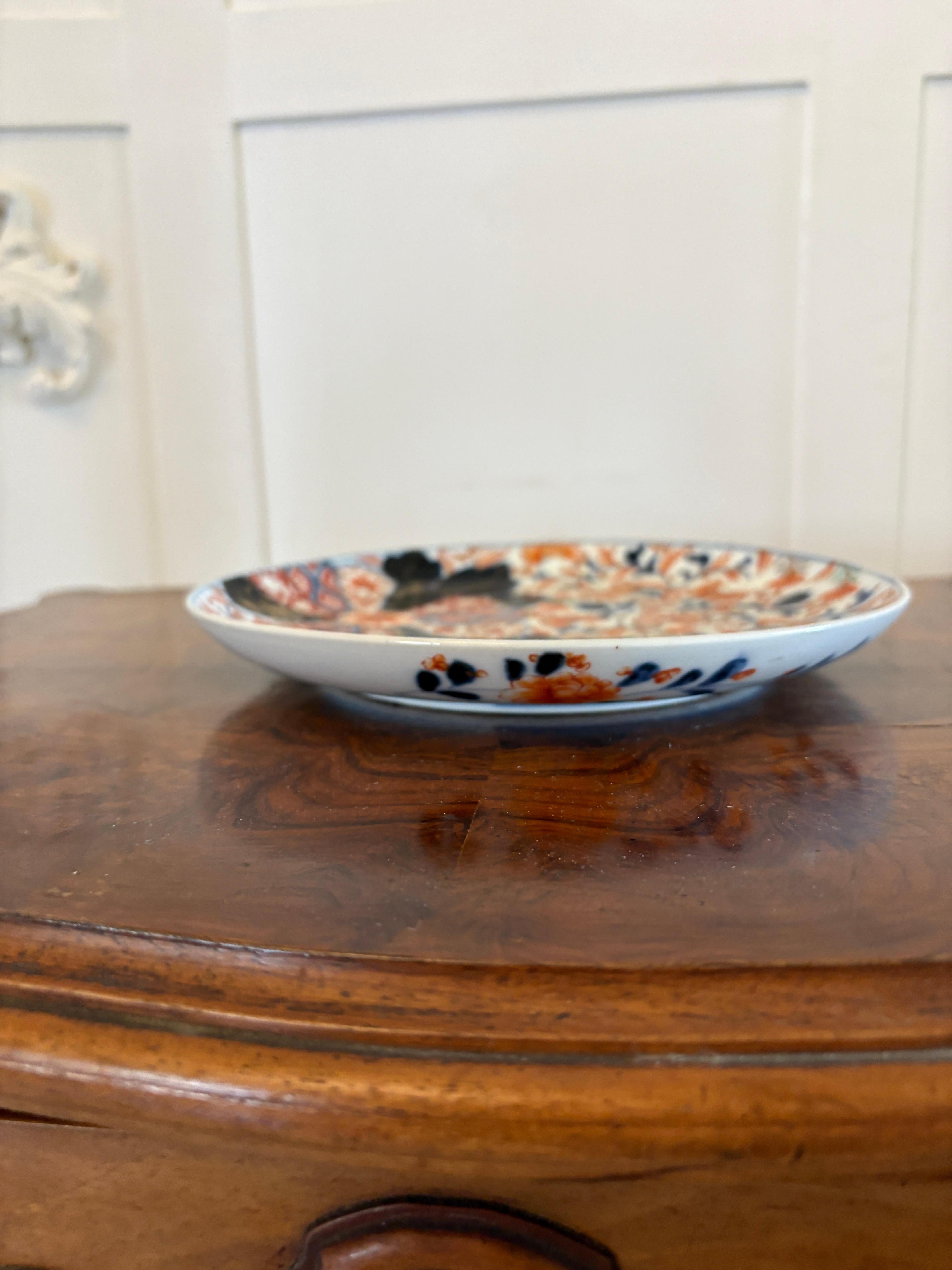 Quality antique Japanese hand painted Imari plate wonderfully hand painted in blue, red, white, gold and black colours 

This is an usual and attractive example.  It is In perfect original condition, no chips, cracks or repairs.

Dimensions:
Height