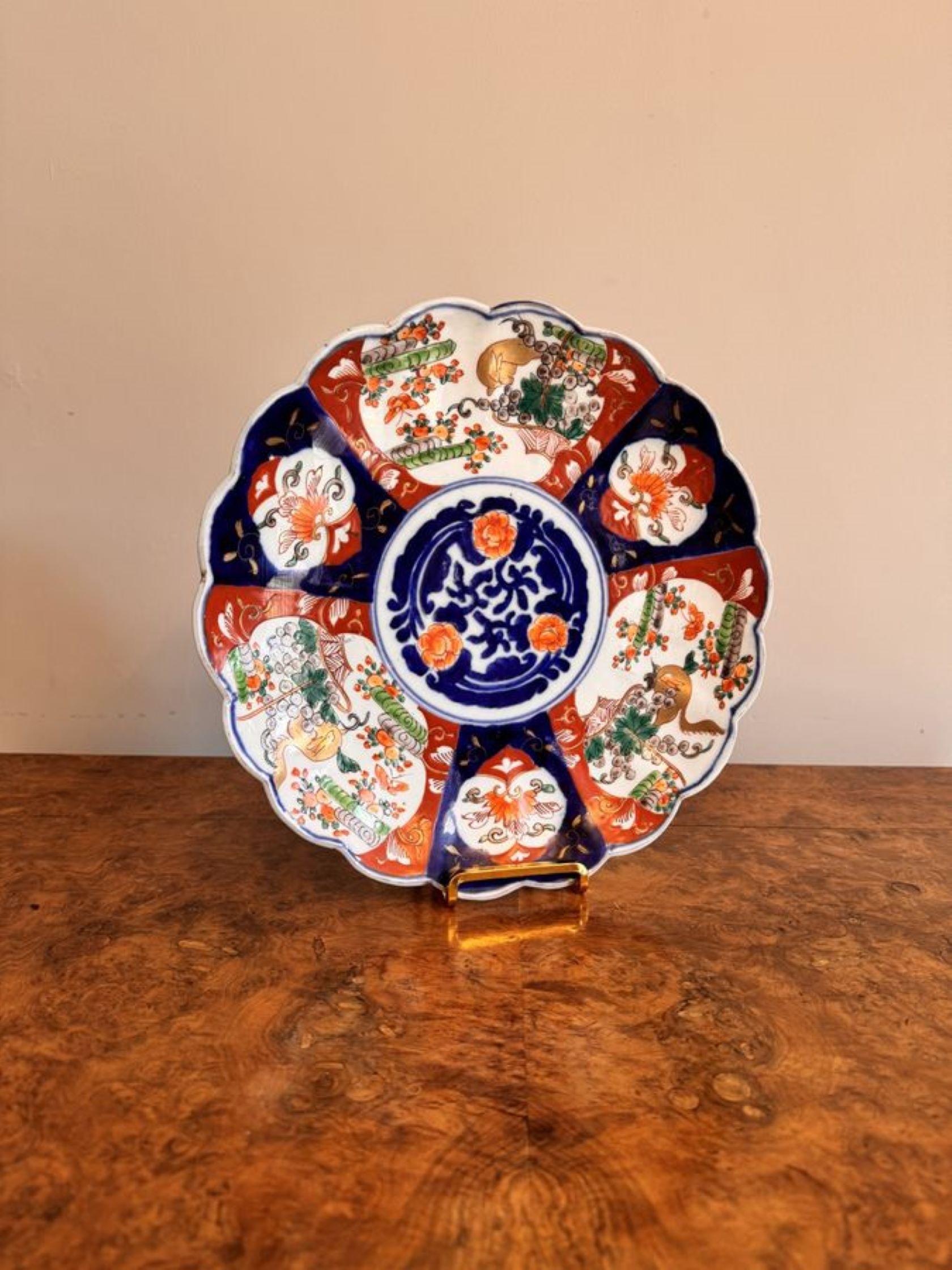 Quality antique Japanese imari plate having a quality Japanese imari plate with flowers to the centre surrounded by panels of hand painted flowers, trees, scrolls and birds in stunning red, blue, gold, green and white colours.

D. 1900