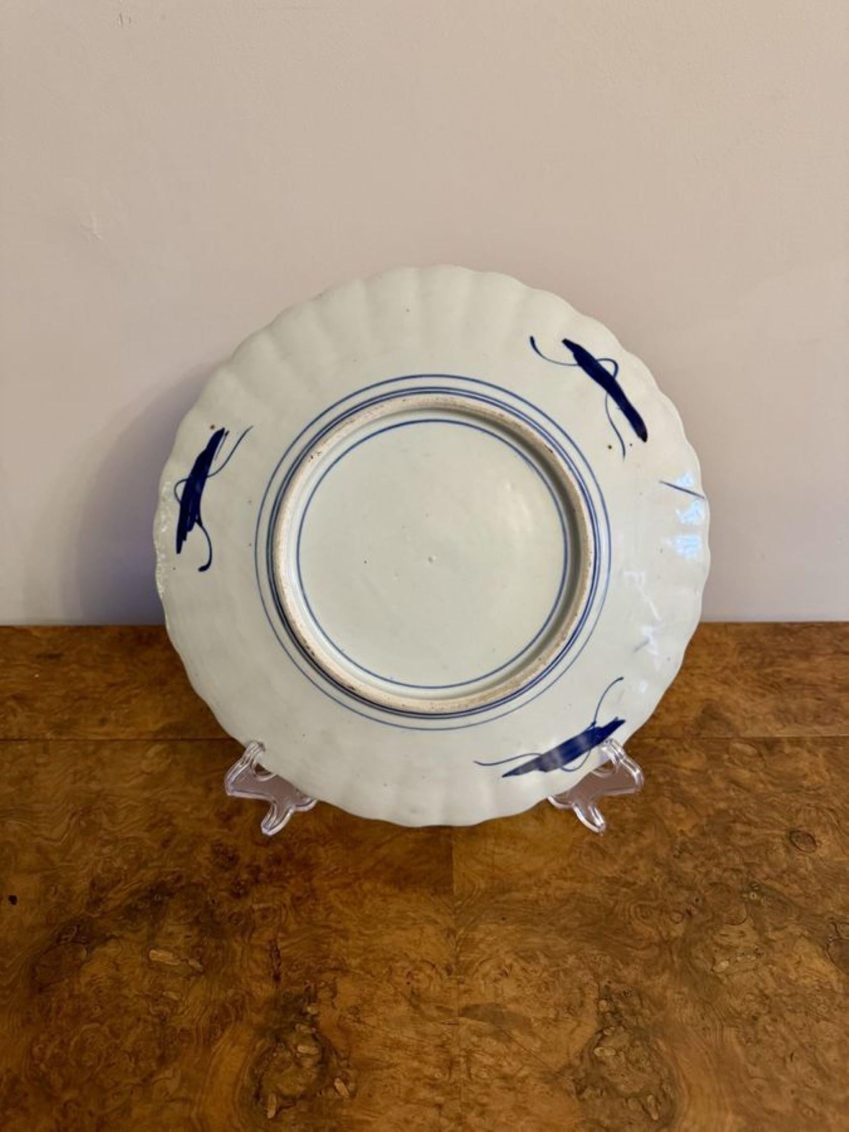 Quality antique Japanese imari plate having a quality antique Japanese imari plate decorated with flowers, trees, blossoms and birds hand painted in wonderful green, red, blue, gold and white colours. 

D. 1900