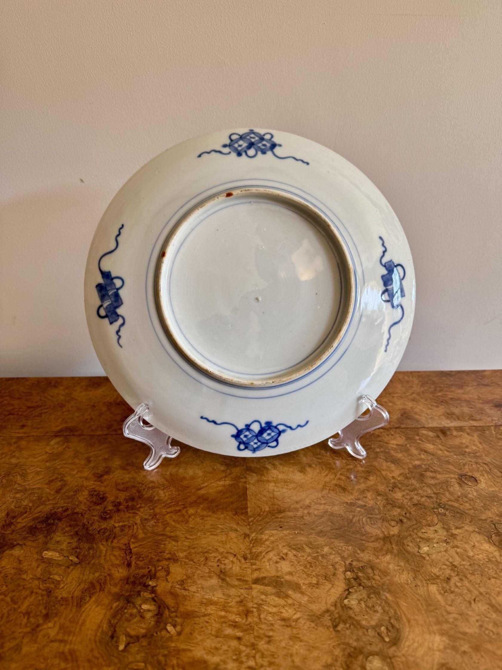 Quality antique Japanese imari plate, having a quality antique Japanese imari plate decorated to the centre with birds, mountains, flowers and trees surrounded by a border with flowers and patterns in wonderful red, green, white and blue