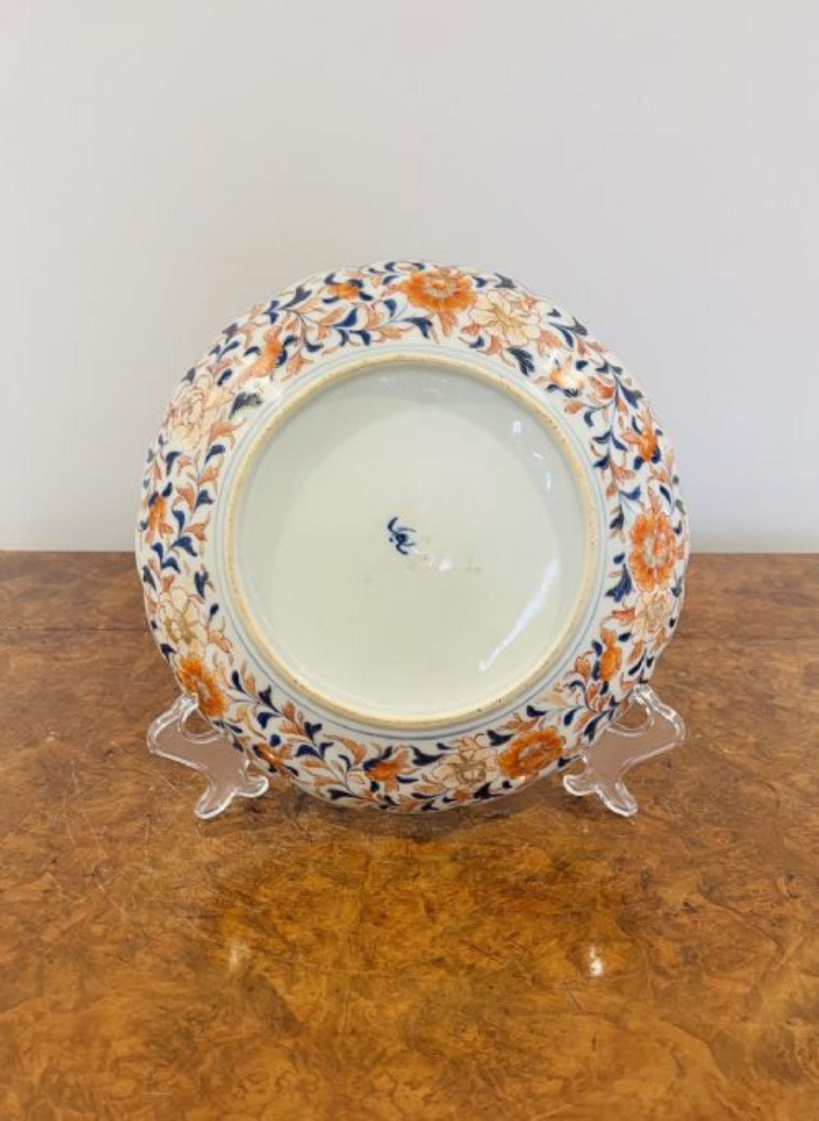 Quality antique Japanese imari plate with a scalloped shaped edge having hand painted panels to the outside with flowers and leaves and to the centre two dragons hand painted in wonderful red, blue, green, white & gold colours.
Small chip to the top