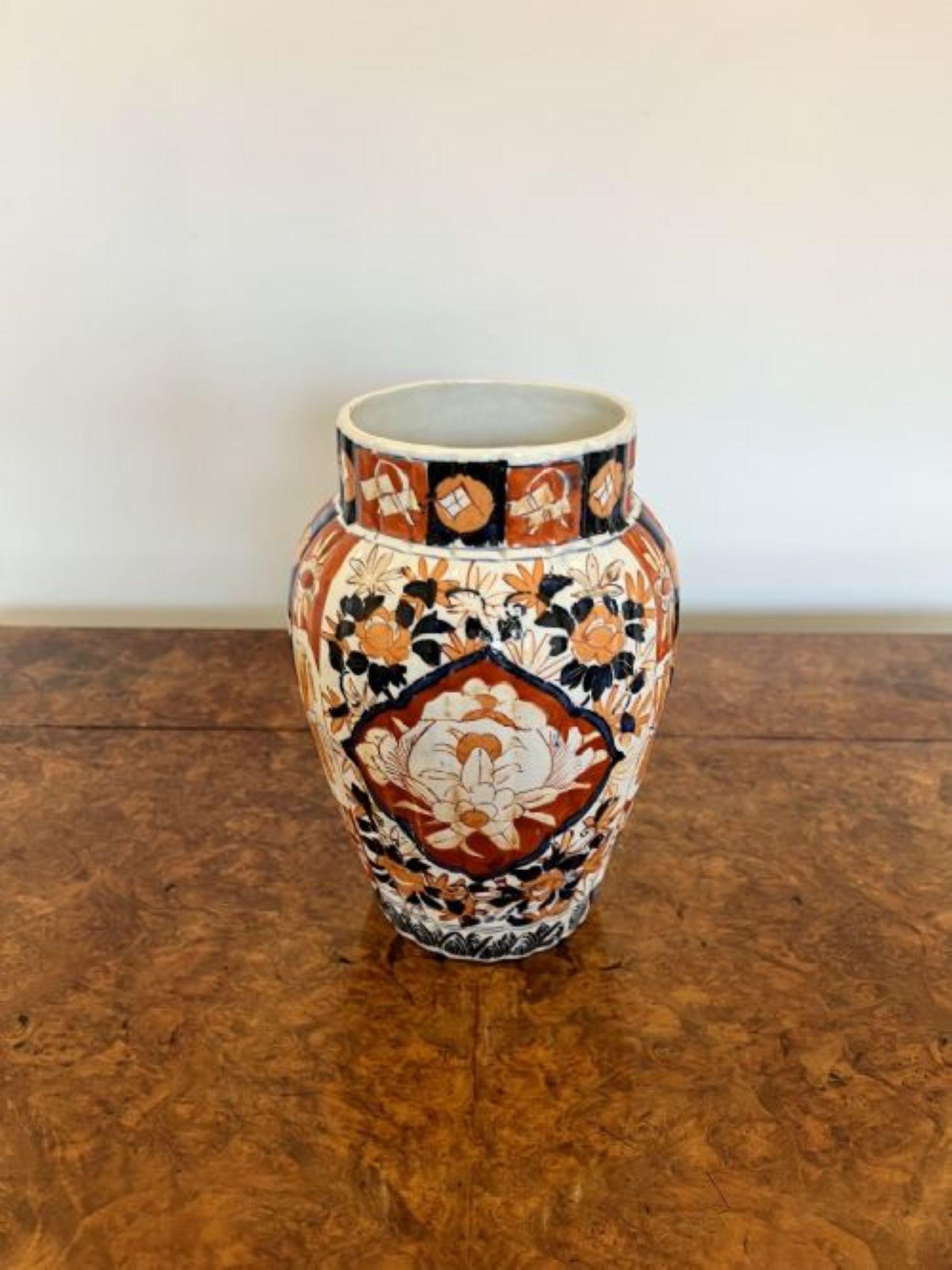 Quality antique Japanese Imari shaped vase, having a quality Japanese Imari vase hand painted in wonderful red, blue, orange and white colours decorated with flowers and leaves.
