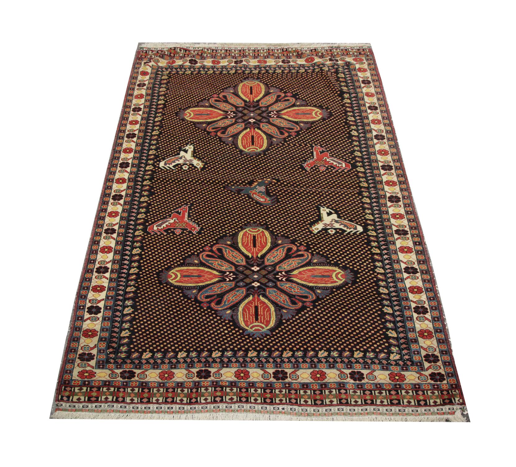Antique rug with two stunning central motifs floats on a dark brown and yellow polka-dot background with contrasting tones of yellow and purple. A Handmade carpet with rich 6 layer border encloses this design with repeat patterns and subtle
