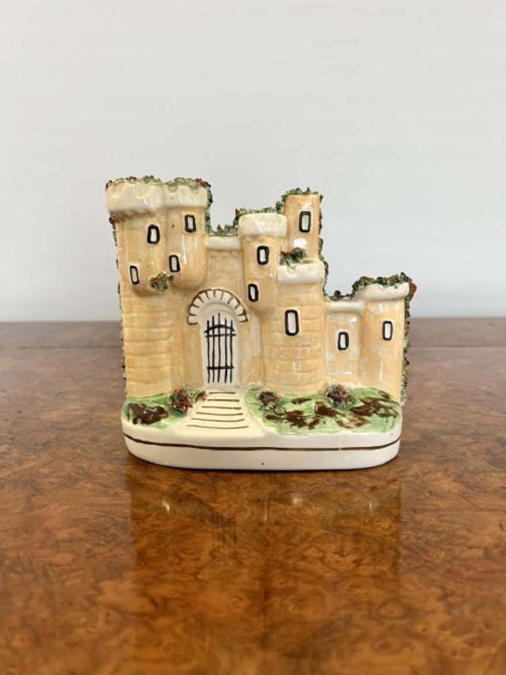 Quality antique Staffordshire flat back castle having a quality antique Victorian Staffordshire figure of a castle hand painted in wonderful brown, green, white and black colours with windows, a front gate and foliage raised on a oval base. 