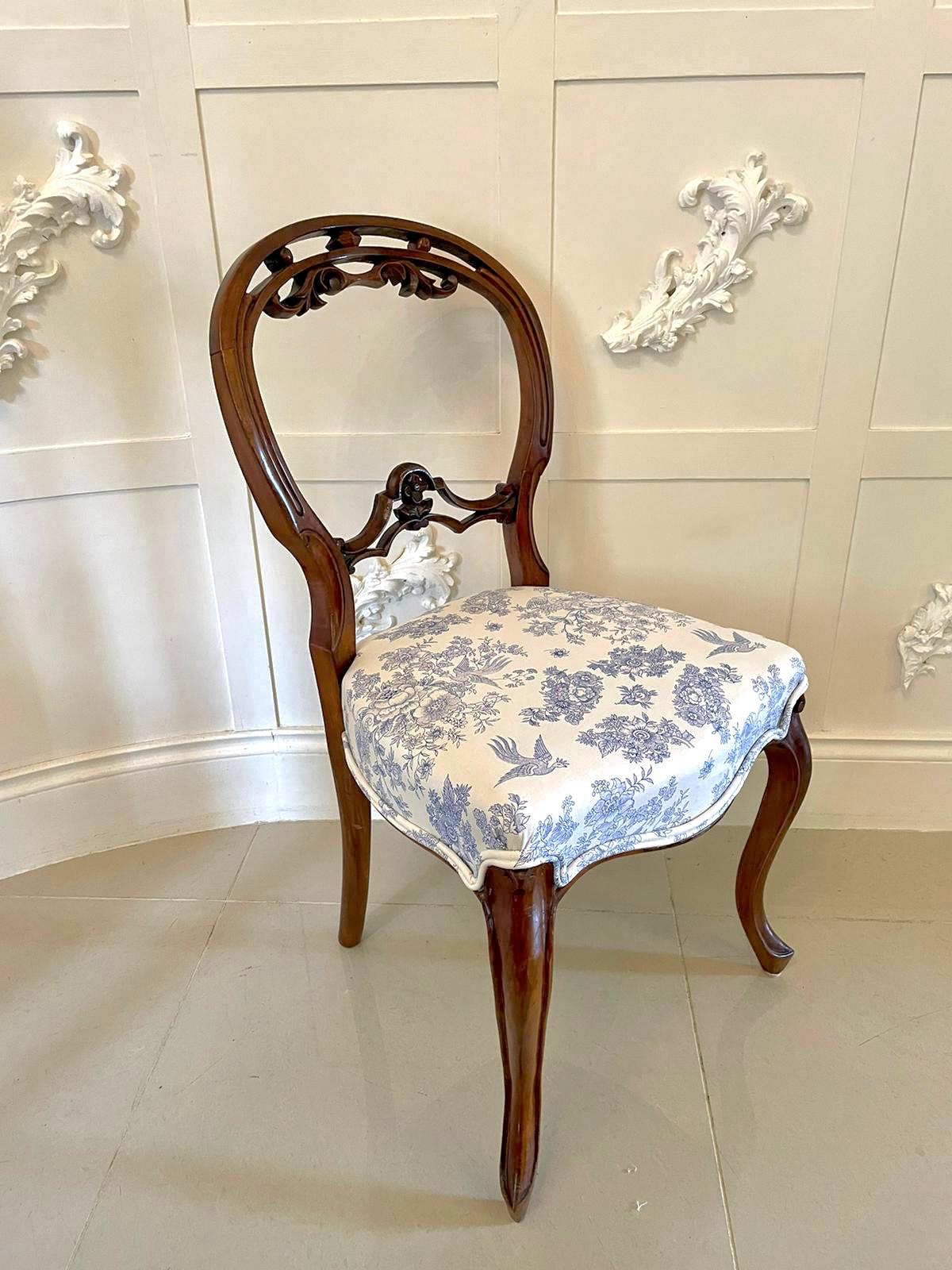 Quality antique Victorian pair of walnut dining chairs having a quality balloon back with a pretty carved top rail and a shaped carved splat to the centre, newly reupholstered serpentine shaped seats in a quality stylish fabric standing on shaped