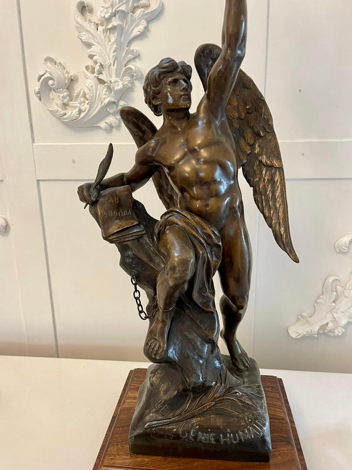 Quality antique Victorian angel spelter table lamp with the original torch shaped shade depicting a male angel holding a torch to one side and a quill and paper to the other standing on a polished oak square stepped base.

An exceptional example