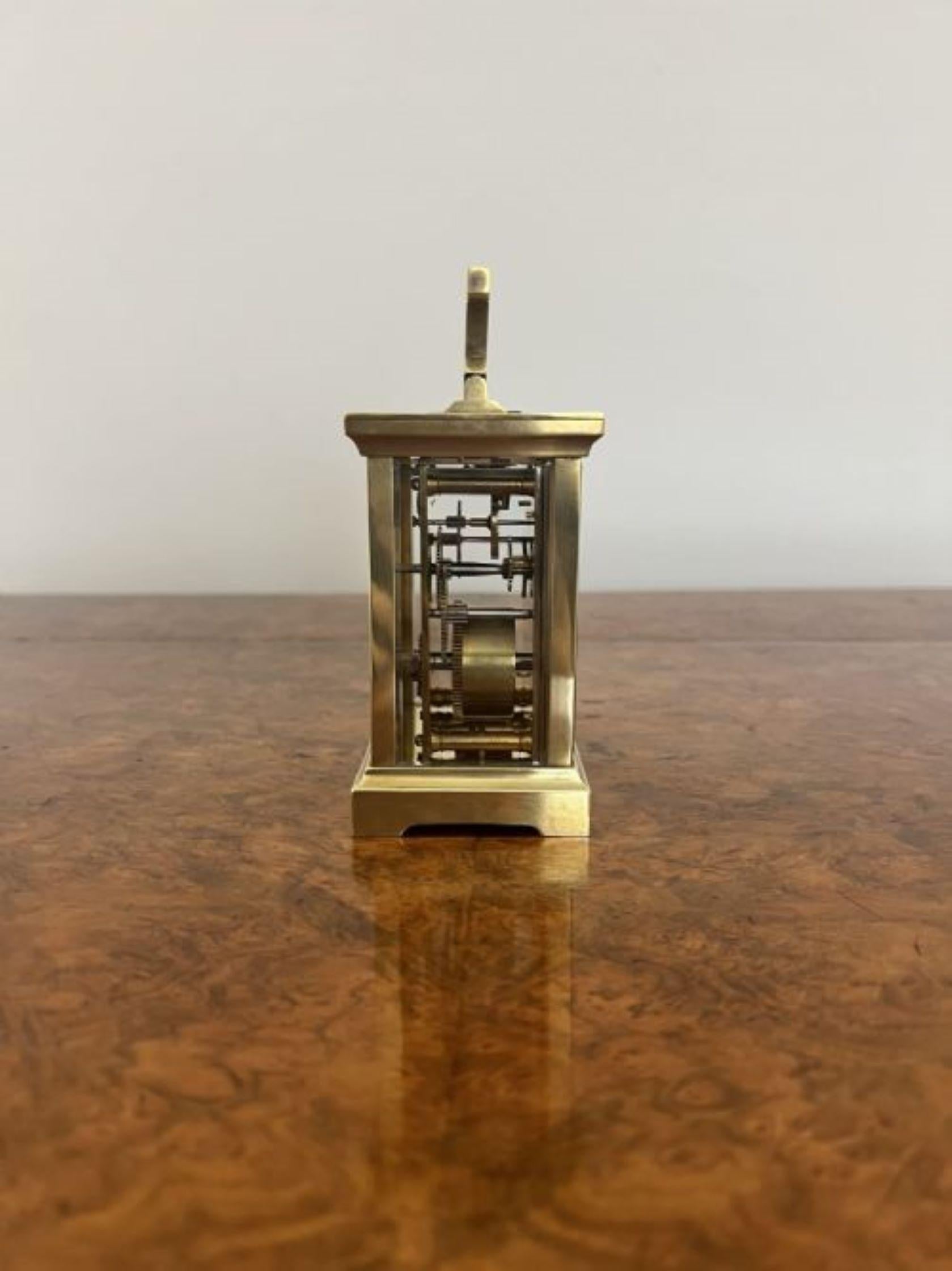 Quality antique brass carriage clock having a quality antique brass carriage clock a white enamel dial with original hands and key, eight day French movement and a handle to the top of the case. 
Please note all of our clocks are serviced prior to