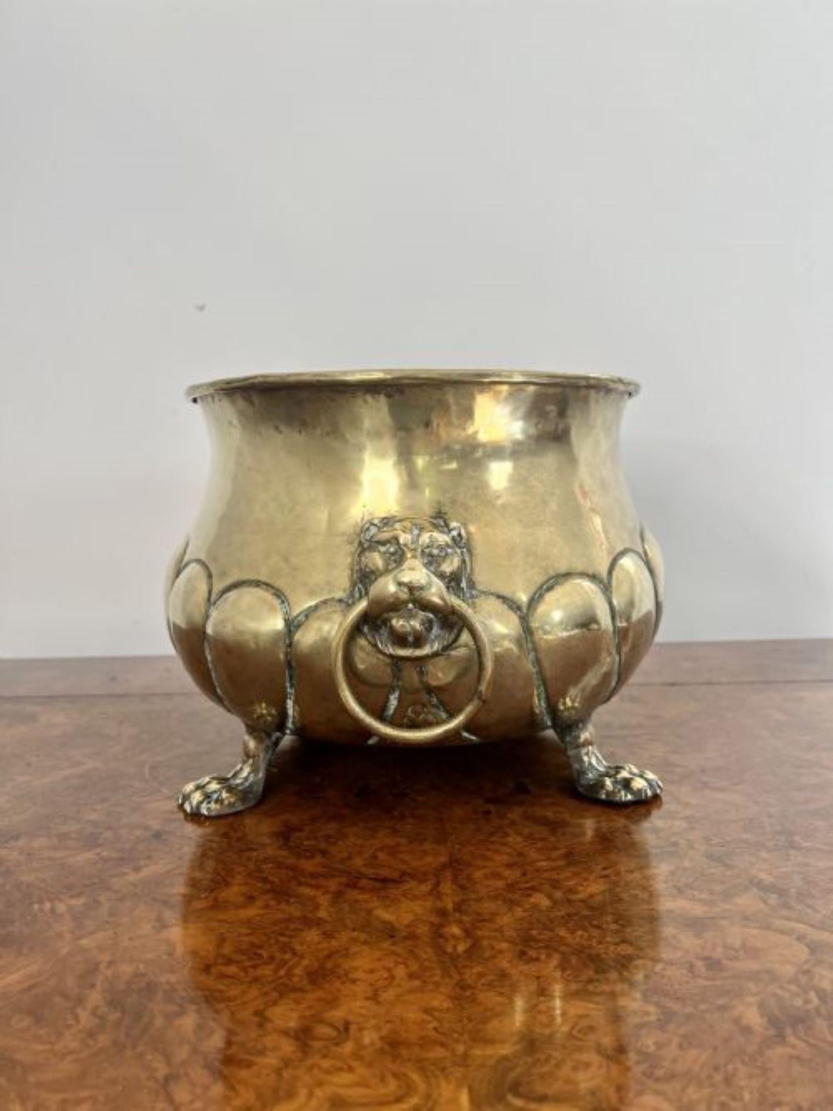 Quality Antique Victorian Brass Jardiniere having a quality antique Victorian brass jardinière with fantastic detail, lion mask handles to the sides standing on claw feet. 