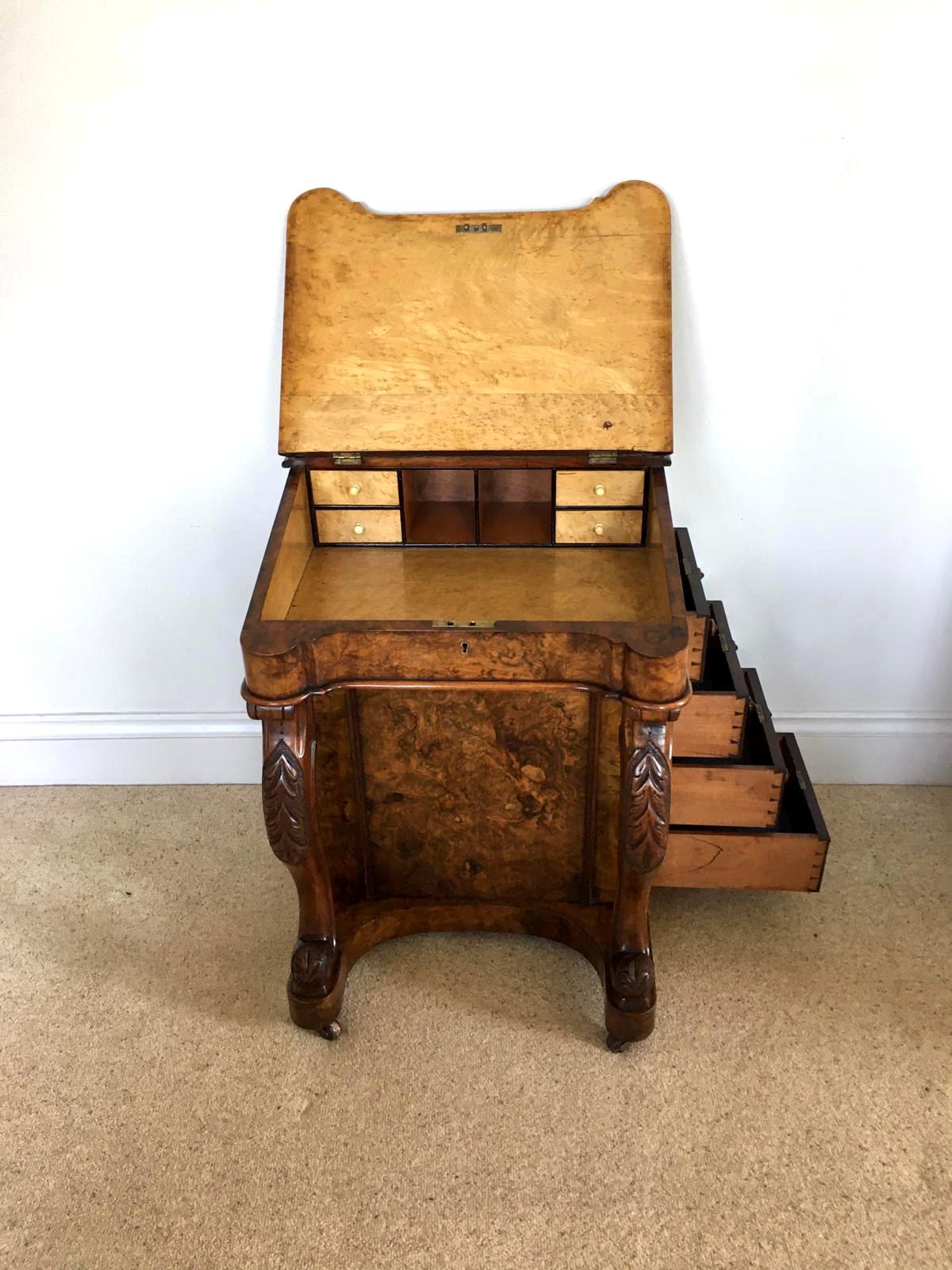 Quality antique Victorian burr walnut freestanding Davenport having a quality burr walnut top with original walnut gallery, shaped burr walnut lift up writing slope with original leather opening to reveal four drawers and pigeon holes, burr walnut