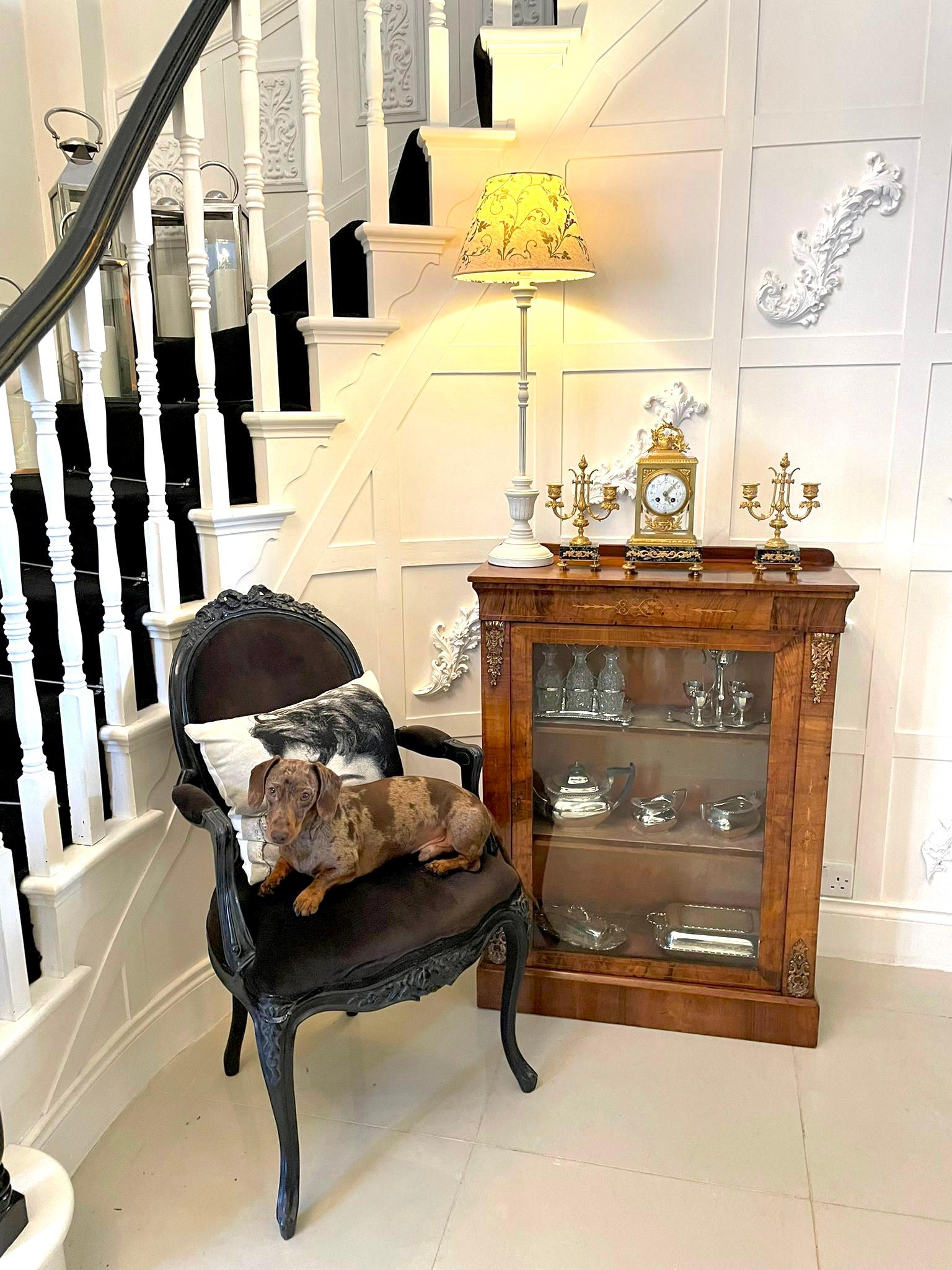 Quality antique Victorian burr walnut inlaid display cabinet having a quality burr walnut top above a walnut frieze with attractive satinwood inlay. The walnut and glazed door opens to reveal two fitted shelves flanked by burr walnut inlaid supports