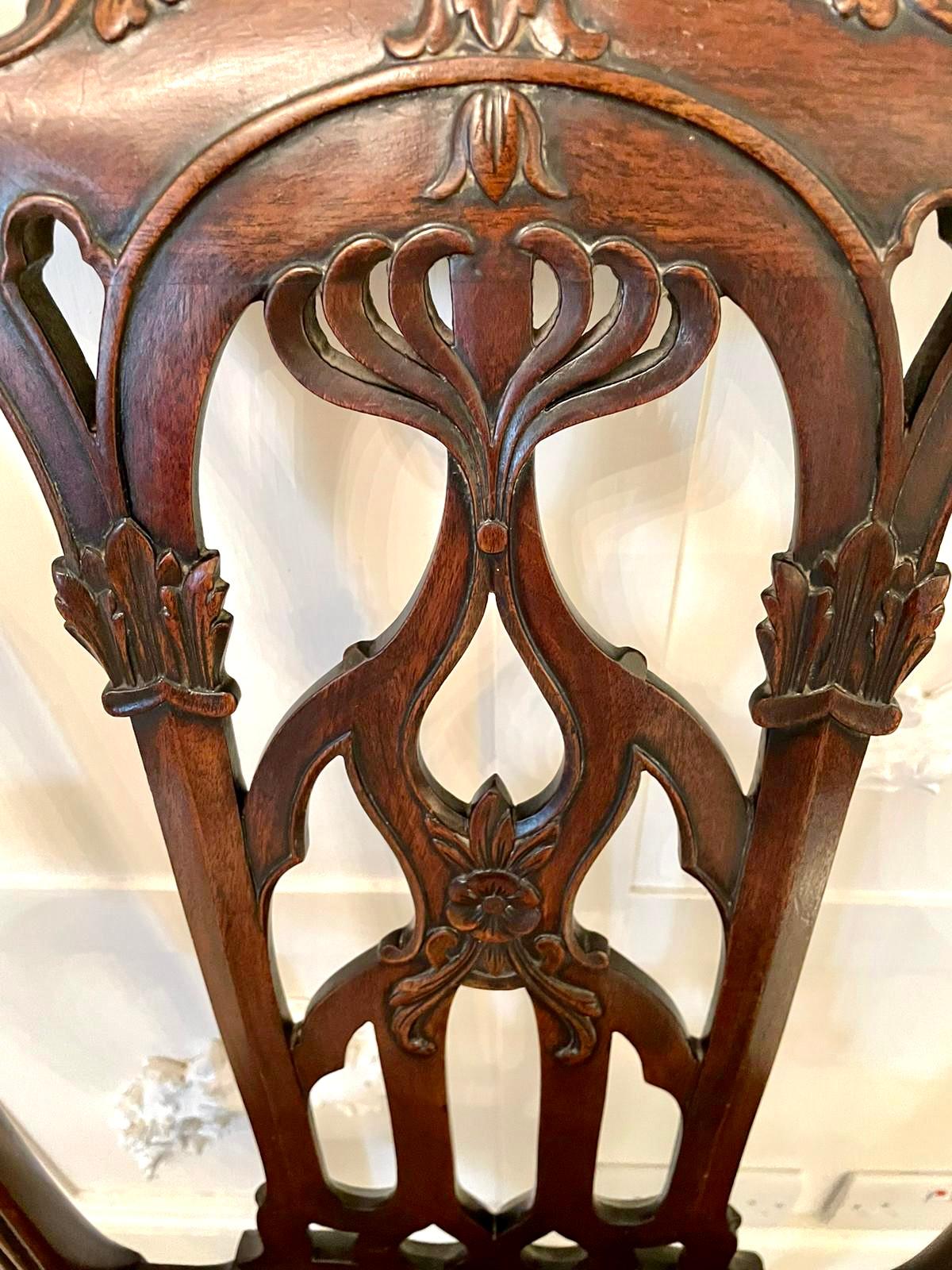 Quality antique Victorian carved mahogany desk chair having a lovely quality carved top rail, carved open fretwork splat to the centre, carved shaped mahogany open arms with shaped supports, leather drop in seat, carved frieze standing on shaped