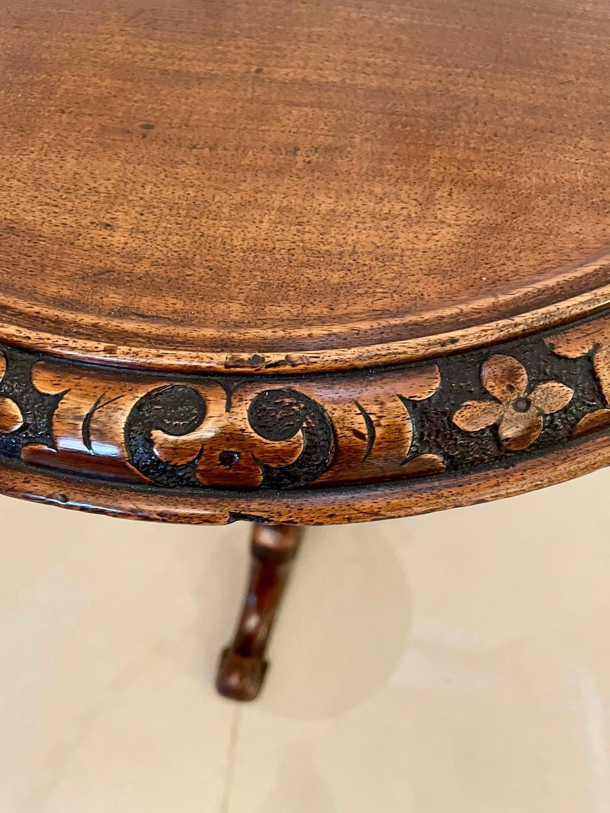 Quality antique Victorian carved walnut circular lamp table having a quality carved walnut circular top supported by an attractive solid carved walnut pedestal raised on three solid carved walnut shaped cabriole legs with scroll feet.

Measures: H