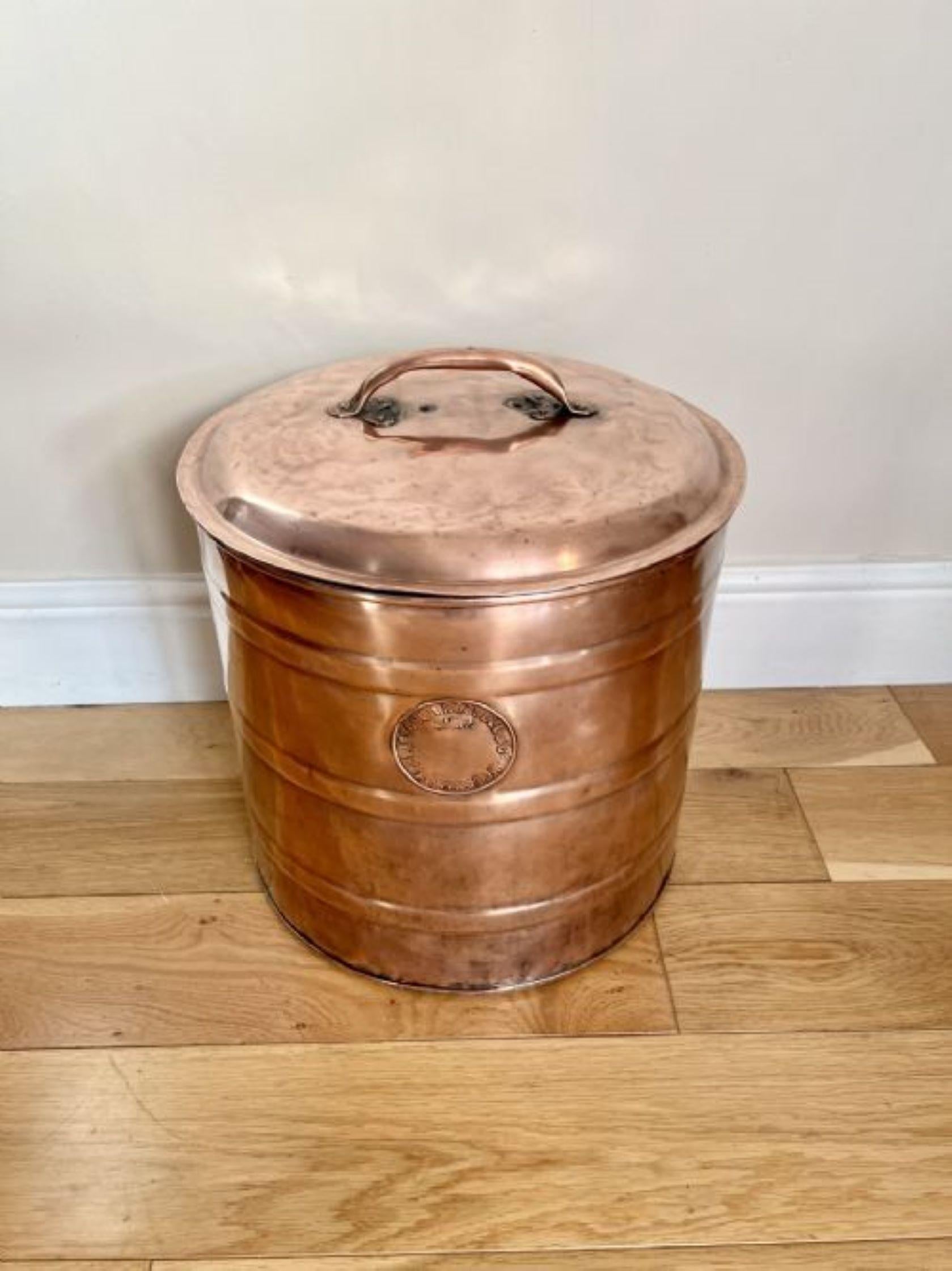 Quality antique Victorian circular copper coal bin having a quality antique Victorian copper coal bin with a lift off lid and a handle to the top 