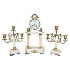 Quality antique Victorian clock garniture with a pair of candelabras 