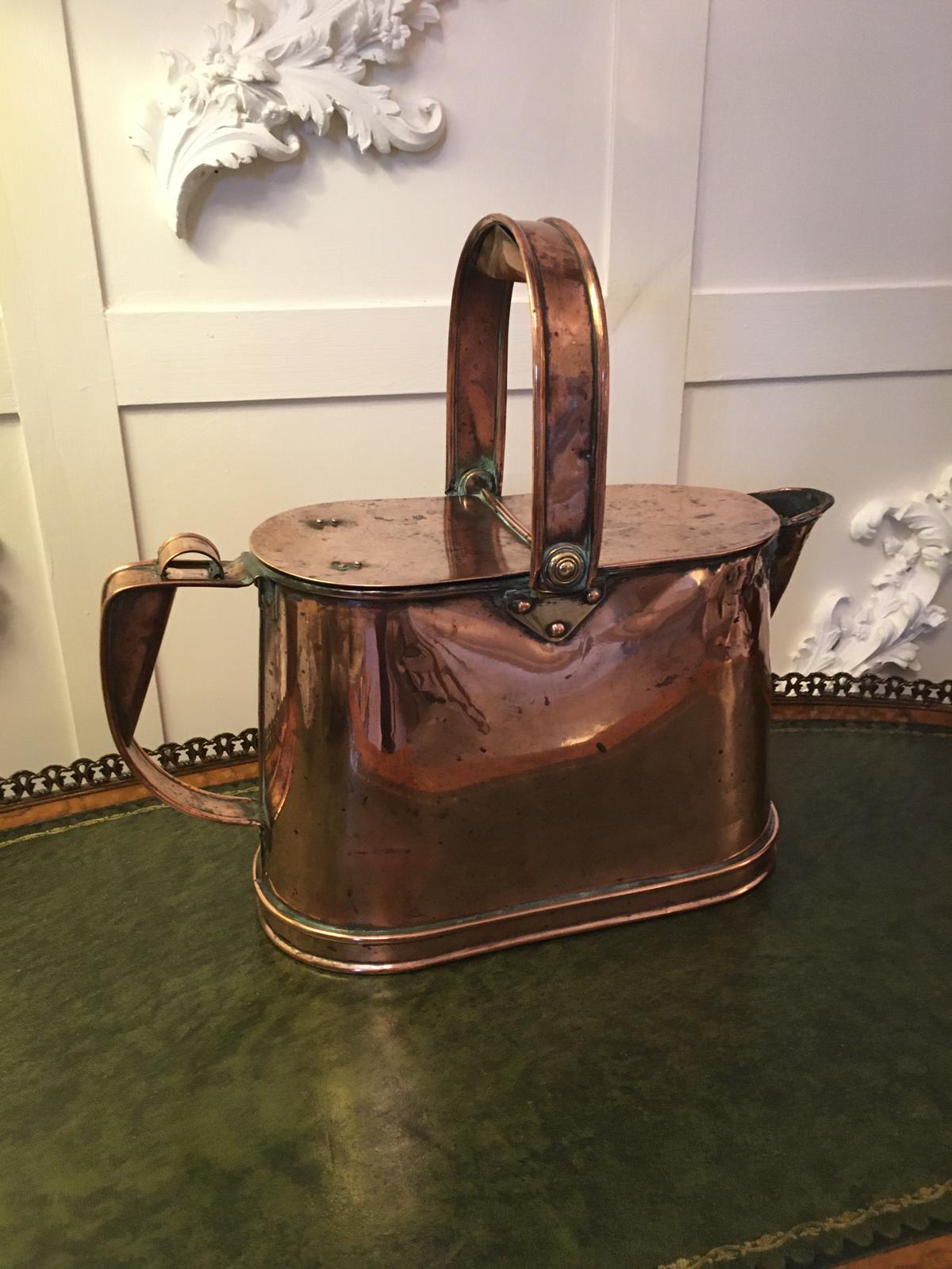 Quality antique Victorian copper watering can having a shaped swing handle with lift up lids, shaped spout and a lovely shaped handle. It stands on a shaped base.

 