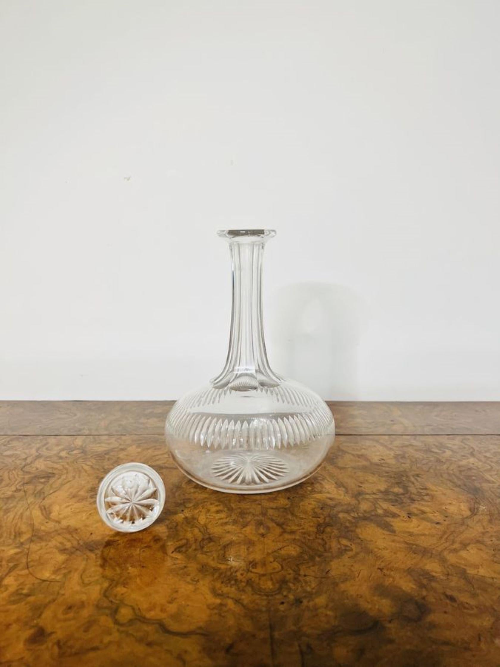 Quality antique Victorian cut glass decanter having a circular body with cut glass detailing with the original glass stopper.

D. 1880