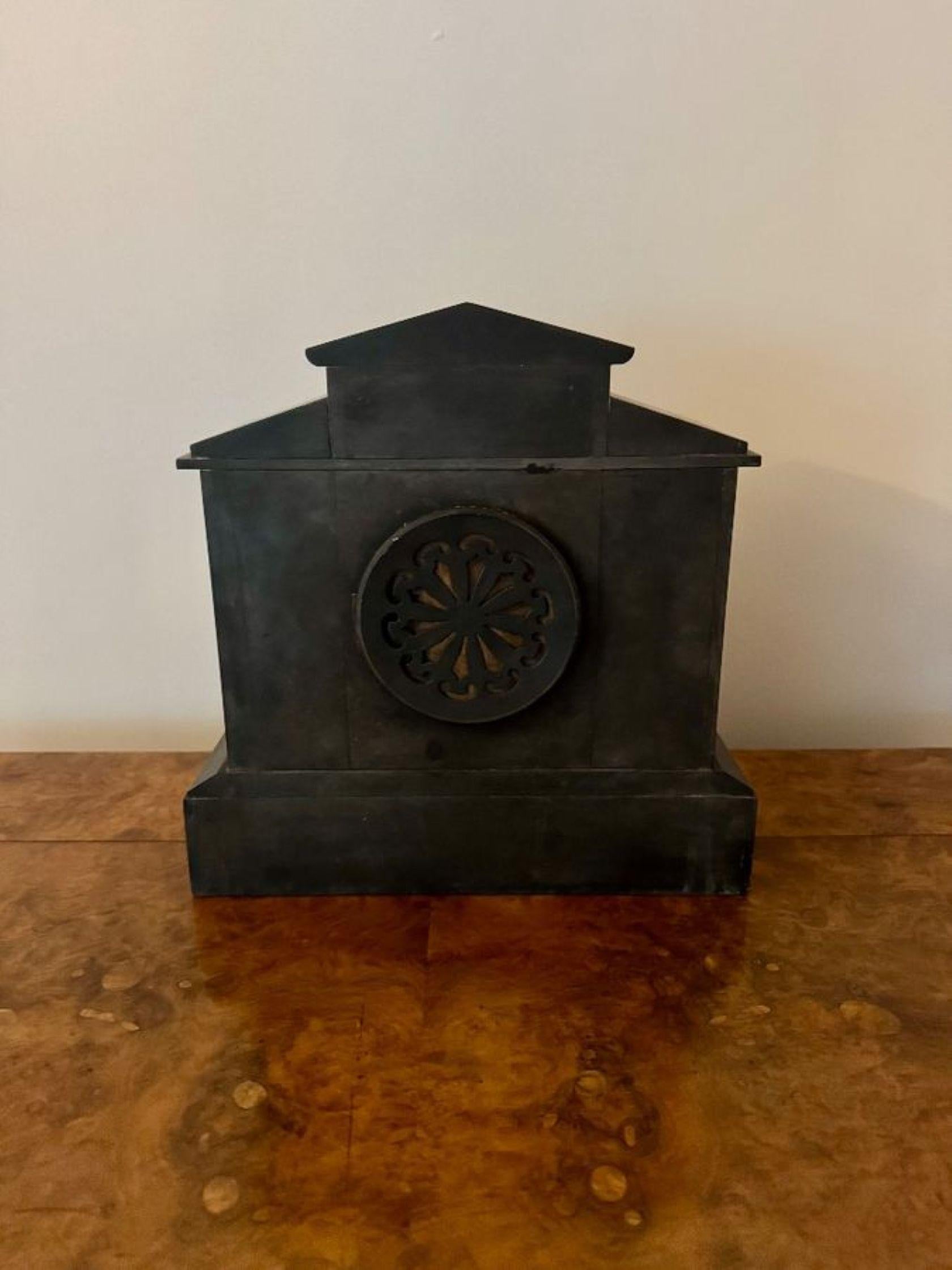 Quality antique Victorian eight day marble mantle clock, having a quality black slate and green marble cased mantel clock with two pairs of green flecked pillars flanking a 3.5inch brass bezel and chapter ring with Arabic numerals and the original