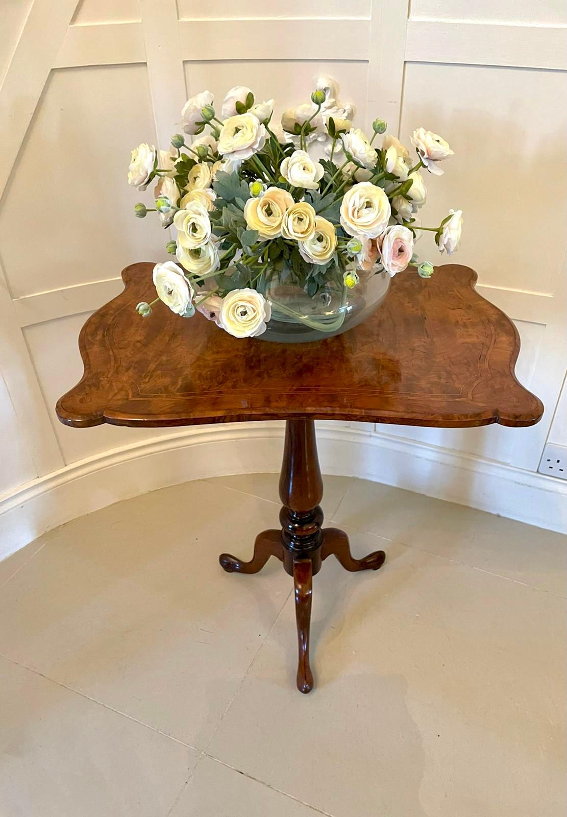 Quality antique Victorian inlaid burr walnut lamp table having a fantastic quality inlaid burr walnut shaped tilting top, raised on a turned shaped column standing on shaped cabriole legs with pad feet.

A wonderful colour and patination.

H